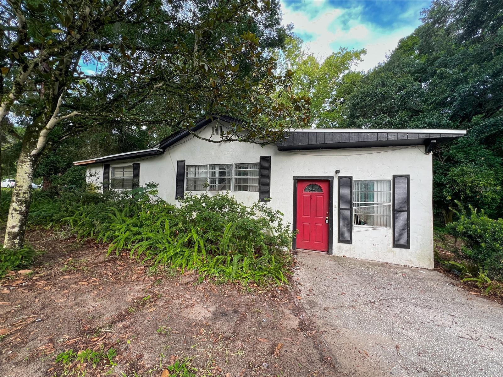 A unique opportunity in SE Gainesville! This 1.66-acre property is situated on a paved road and is nearly completely wooded for privacy. The home is not habitable and will likely need to be demolished. The value is in the acreage. Located less than 10 minutes from downtown Gainesville as well as nearby nature attractions such as Newnans Lake, Morningside Nature Center and La Chua Trail!