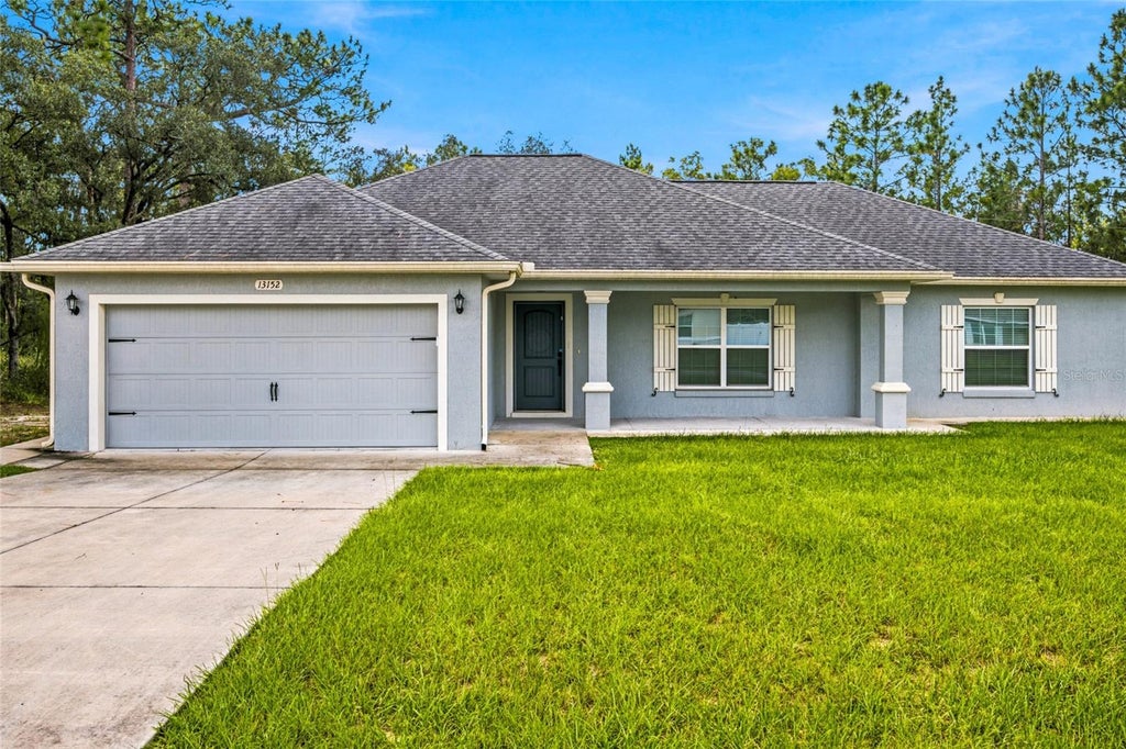 Photo of 13152 SW 65th Circle, Ocala, FL 34473 (MLS # OM731023)