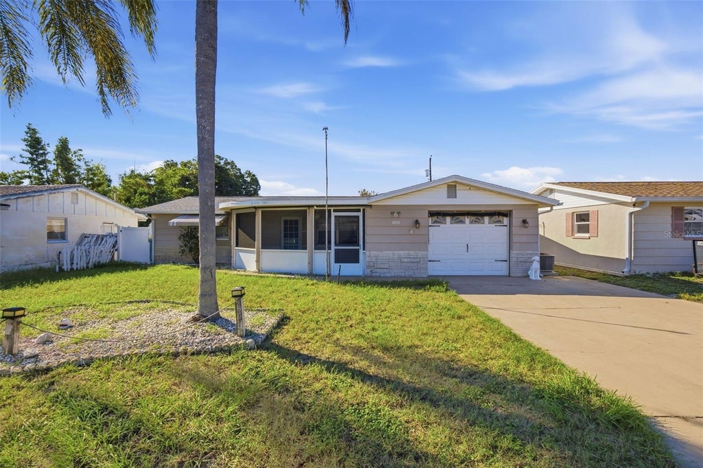 Photo of 4030 Cluster Drive, Holiday, FL 34691 (MLS # TB8557428)
