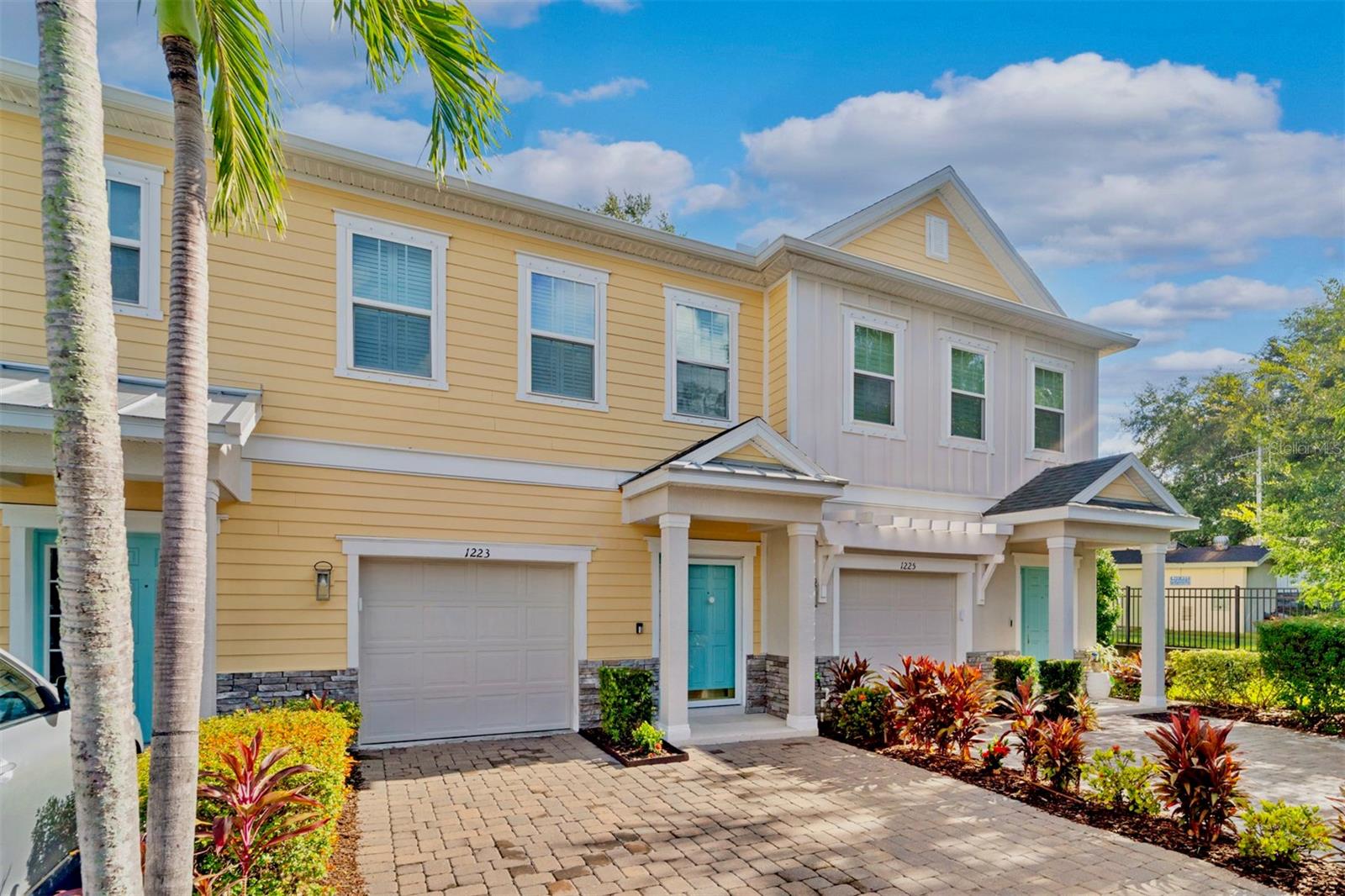 Welcome home to Aqua Solis. Located in highly sought-after and walkable Dunedin, you will quickly see why the city was awarded one of the Best Small Towns to Live in the US by Travel + Leisure. This nearly new townhome boasts attractive Key West style architecture and is highly upgraded. Located in a non-flood zone and only 1 mile from the heart of downtown Dunedin, this community is a hidden gem. This residence is tucked away on a quiet cul-de-sac and has peaceful wooded backyard views with no rear neighbors- one of the best locations in the community! Inside you will enjoy the open concept living space with airy, high ceilings, crown moldings and plank style ceramic flooring- an area designed for modern living. Highlights of the upgraded kitchen include white cabinets with slide out drawers, sleek granite countertops, newer stainless steel appliances, tile backsplash, under cabinet lighting, a large island, pantry, and ample storage space. A 3 panel slider leads to your private lanai- a zen like place to unwind. Upstairs, this popular floorplan has two spacious primary suites, each with a spa inspired ensuite bathroom with quartz counters and double sinks. One of the baths includes both a soaking tub and step in shower. Both suites also boast new custom walk in closets to keep everything perfectly organized. A laundry area with newer LG washer and dryer included completes the second floor. Other upgrades include new carpeting (2022), freshly painted interior (2022), plantation shutters on all windows and the sliding door, ceiling fans, and a UV light upgrade to the HVAC for improved indoor air quality. 1 car garage plus double spaced paver driveway. This home is Energy Star rated, resulting in lower utility bills and improved comfort. Enjoy low maintenance living with a very low HOA fee. When it’s time to relax, take a dip in the pool or enjoy a short golf cart or bike ride to scenic Edgewater Drive along the waterfront to capture an incredible sunset. Aqua Solis is a picturesque, gated community with amenities including a pool, dog park and community trail. Located in the golf cart zone and close to the Pinellas Trail, hospital, Blue Jays spring training stadium and just 1 mile to historic downtown Dunedin’s charming shops, restaurants, parks, weekly farmers market, and popular arts and music festivals. Paradise awaits at award winning nearby beaches including Honeymoon Island, Clearwater Beach and Caladesi Island. This highly desirable location is just a 30 minute drive to 2 international airports as well. Whether for your primary residence or a seasonal escape, this home is the definition of move in ready. Do not miss your chance to own a piece of paradise at Aqua Solis.