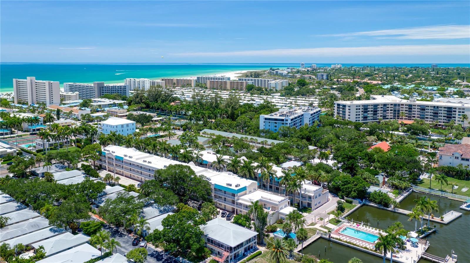 Welcome to your perfect Siesta Key getaway! This beautifully updated 2-bedroom, 2-bath end-unit condo in the Palm Bay Club offers stunning bay views, a bright, open interior, and resort-style amenities—just steps from the Bayfront pool.
At 1,270 sq. ft., this is one of the largest condos in Palm Bay. You'll love the driftwood-style cabinetry, quartz countertops, and stainless steel appliances in the spacious kitchen, all set against modern wood-look ceramic tile flooring throughout.
The living room features a sleeper sofa, allowing the unit to comfortably accommodate up to 6 guests. Enjoy your morning coffee or evening wine on the private balcony, overlooking the lush courtyard and bay.
Highlights:
Bayfront views from a serene end unit
2 bedrooms, 2 baths + sleeper sofa (sleeps 6)
Fully updated kitchen & flooring
Balcony with water & courtyard views
Steps to the Bayfront pool
Palm Bay Club Amenities:
Private beach access to the #1 Beach in the U.S.
2 heated pools + hot tub
Tennis & pickleball courts (lighted)
Fitness center
Fishing pier & boat docks (available for rental)
BBQ grills, laundry on each floor
Free trolley to Siesta Key Village & Turtle Beach
24-hour security
Policies:
No smoking
No pets (service animals require prior approval)
One parking space per unit; no visitor passes during Spring Break/Holiday weeks
Living room TV with DirecTV; bring your own Roku/Firestick for streaming in bedrooms
Whether it’s a long weekend or an extended beach stay, this Gulf-to-Bay resort condo delivers the full Siesta Key experience in comfort and style. Book your stay and enjoy paradise!