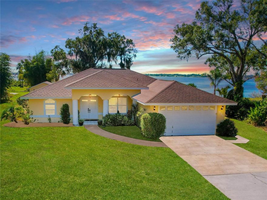 Experience true lakefront living on beautiful Lake Reedy, with breathtaking water views from nearly every room of the home. This inviting 3-bedroom, 2-bath residence with a 2-car garage sits on just under an acre, offering space, privacy, and stunning surroundings. 

Inside, over 1,700 square feet of well-designed living space includes a welcoming living room, a dedicated dining area, and a spacious kitchen featuring abundant cabinetry, generous counter space, a closet pantry, breakfast nook, and a built-in desk area. The split-bedroom floor plan provides added privacy, while the expansive primary suite showcases three closets and a well-appointed bath with dual sinks, a garden tub, and a separate shower. Updated laminate flooring flows throughout the bedrooms and family room, with no carpet anywhere in the home. A large interior laundry room enhances functionality with ample cabinetry, storage, and a utility sink.

Outdoor living truly shines here. An enclosed patio connects seamlessly to the kitchen, living room, and primary bedroom, while the oversized rear screened patio offers the perfect space for entertaining, relaxing, and enjoying unforgettable lake sunsets. The private pier, built in November 2018, includes both water and electric service, ideal for boating and waterfront enjoyment. The thoughtfully maintained grounds feature updated landscaping, creating a park-like setting that enhances both curb appeal and everyday enjoyment.

Adding exceptional value is the detached workshop, fully equipped with electricity and offering endless possibilities—perfect for a hobbyist, home business, artist studio, or additional storage for tools, watercraft, or recreational equipment.

Recent updates include a roof approximately 5 years old and a water heater replaced 3 years ago, providing added peace of mind. This remarkable lakefront property combines comfort, flexibility, and incredible views, making it an ideal full-time residence or serene getaway.