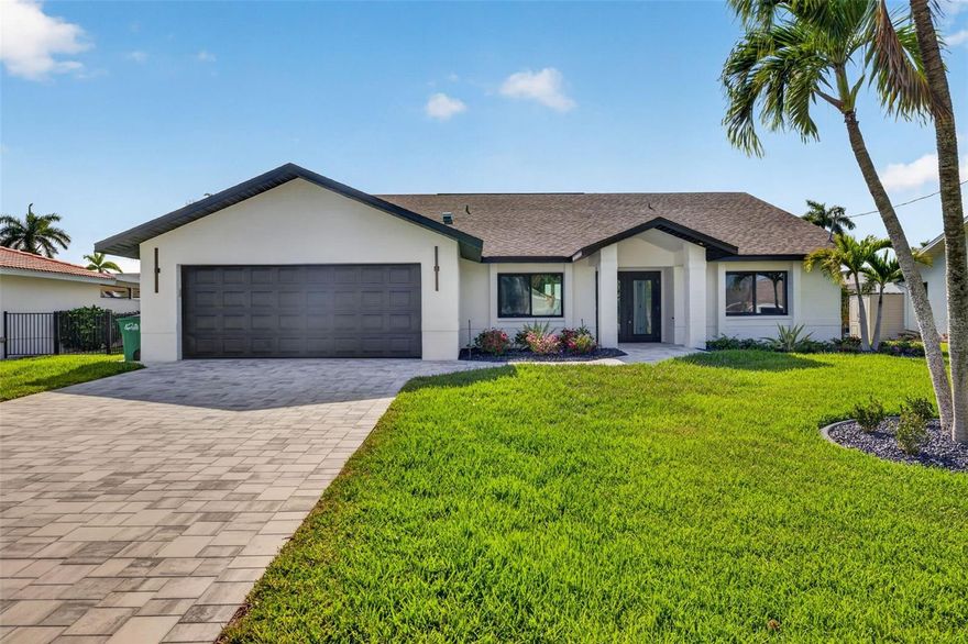 One or more photo(s) has been virtually staged. Welcome to your fully reimagined waterfront retreat—where modern luxury meets income-producing potential. This 4-bedroom plus a den, 4-bathroom home has been completely renovated down to the studs, offering the style, efficiency, and peace of mind of new construction in one of Cape Coral’s most desirable neighborhoods. Tucked away on a quiet, palm tree-lined street, this property features deep water, direct sailboat Gulf access with just a 15-minute ride to open water—a rare and highly sought-after combination for both boaters and vacation renters. Quick drive or boat ride to Cape Harbour, Tarpon Point, Fort Myers Beach, Sanibel, Captiva and surrounding islands. Inside, the home showcases high-end luxury finishes throughout, including a designer kitchen with black stainless GE Café appliances and premium quartz countertops, all flowing seamlessly into open-concept living spaces designed for both everyday living and effortless entertaining. The true showstopper is the seamless indoor-outdoor living experience. Four stunning pocketing sliders fully open to the lanai, creating an expansive, airy flow that defines the Florida lifestyle. The lanai is enhanced by a picture window screen enclosure, offering unobstructed water views, along with a premium travertine pool deck and a beautifully finished tongue-and-groove, weatherproof stained wood ceiling, adding warmth and architectural detail to your outdoor living space. Step outside to your private tropical oasis featuring a completely renovated pool with all-new equipment, perfect for relaxing or hosting guests year-round. Beyond the beauty, this home delivers exceptional value with a fully permitted and inspected renovation, including all-new plumbing, electrical, HVAC, and spray foam insulation for maximum energy efficiency. The home is outfitted with PGT impact windows, doors, and sliders, providing superior storm protection and potential insurance savings. With 4 bedrooms (2 en-suite) and 4 full bathrooms and a den that could function as a fifth bedroom, this property is ideally suited for high-performing Airbnb or seasonal rental use, comfortably accommodating larger groups and maximizing income potential in a premier waterfront location. All work has been professionally completed, permitted, and inspected by a licensed Florida contractor, offering total confidence in quality and craftsmanship. Whether you’re searching for a luxury primary residence, seasonal escape, or income-producing waterfront investment, this is a rare opportunity to own a like-new Gulf access home that truly has it all.