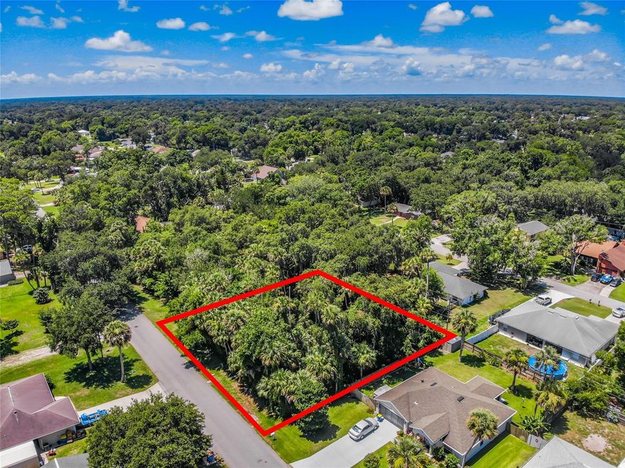 Dreams begin here on this three lot parcel in Florida Shores.  This is the perfect location to build your dream home.  Located on the west corner of 22nd and Juniper.  Close to I-95, 442 and US1.  6 miles to New Smyrna Beach.; Cleared: No