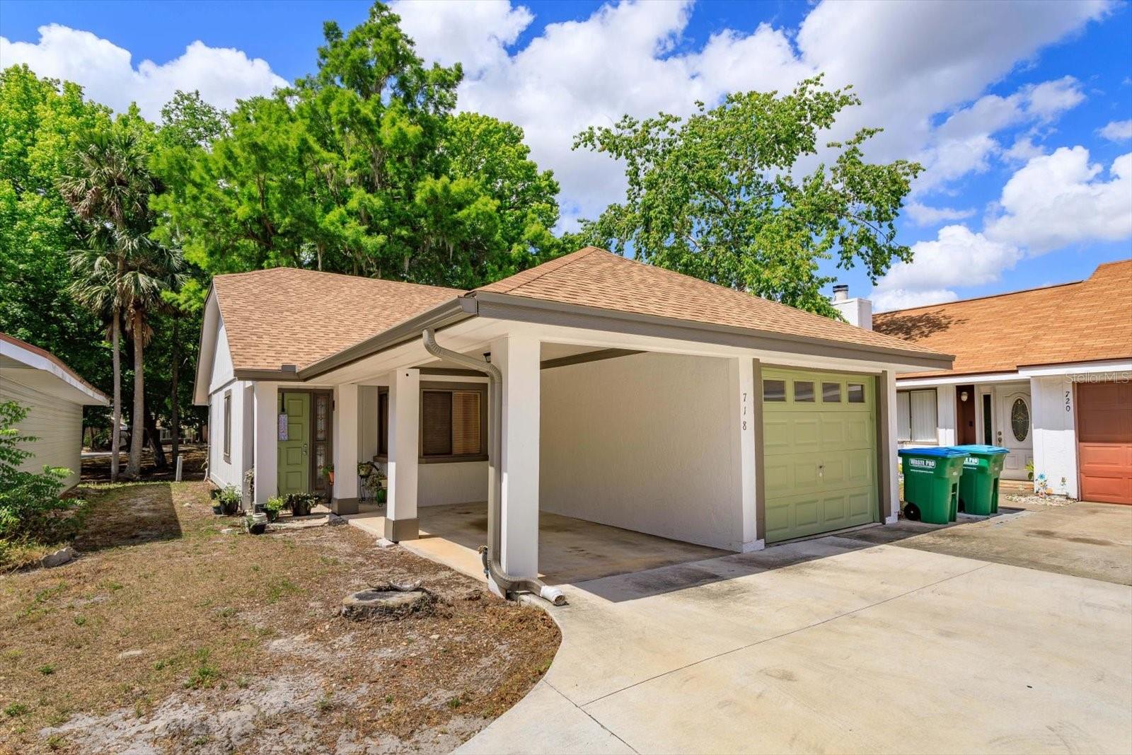 Discover the perfect blend of privacy, low-maintenance living, and style in this freestanding 2-bedroom, 2-bath townhome in the desirable Wildwood community of Winter Springs. With no shared walls and a single-family feel, this home features vaulted ceilings, open living and dining areas, and abundant natural light throughout. The primary suite is generously sized with an en-suite bath and ample closet space, offering a comfortable retreat. A newer roof (2022) and a screened-in back porch add lasting value and versatility - ideal for morning coffee or evening unwinding. Parking is easy with a one-car garage, covered carport, and an additional assigned space. Enjoy access to well-maintained amenities including a pool, tennis and pickleball courts, playground, dog park, and more - all tucked beneath mature trees in a peaceful, established community. Located just minutes from Big Tree Park, major roadways, and everyday essentials, the home offers both comfort and convenience in a well-established setting.