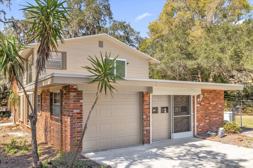 Welcome to 1610 Glenwood Drive, a fully renovated 4-bedroom, 2.5-bathroom home that sits on a quiet and expansive .75-acre lot. This 2,080-square-foot split-level residence has been completely remodeled from top to bottom to provide a clean, updated living space that is ready for its next owners. The moment you walk in, you’ll notice how the huge windows throughout the main living areas flood the home with an incredible amount of natural light, making the entire interior feel bright and open.

The heart of the home is the brand-new kitchen, featuring fresh cabinetry, elegant granite countertops, and a full suite of new stainless steel appliances.  The split-level design creates a practical layout with plenty of space for family, guests, or a home office. Beyond the cosmetic updates, this home offers significant long-term value with a brand-new roof and a brand-new AC system, ensuring the most expensive maintenance items are already handled for years to come.

The outdoor space is a major asset for this property, providing plenty of room to roam on a generous three-quarter-acre lot. The backyard is fully fenced for privacy and security, and the property includes a large detached workshop already equipped with electricity—perfect for a home business, hobby shop, or extra storage. Additionally, there is a huge Florida room that adds substantial extra living space to the floor plan, offering a great spot to enjoy views of the yard.

Located on a peaceful street in DeLand, 1610 Glenwood Drive combines a full renovation with the land and utility that are often hard to find at this price point. Every inch of the 2,080 square feet has been touched, ensuring a completely move-in-ready experience. This is a solid, updated home that offers a rare opportunity to enjoy a large piece of land with none of the typical maintenance headaches.