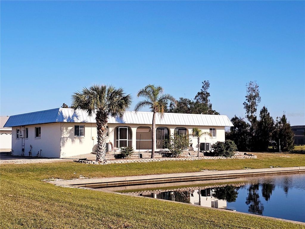 Photo of 122 Boundary Boulevard #A, Rotonda West, FL 33947 (MLS # S5145103)