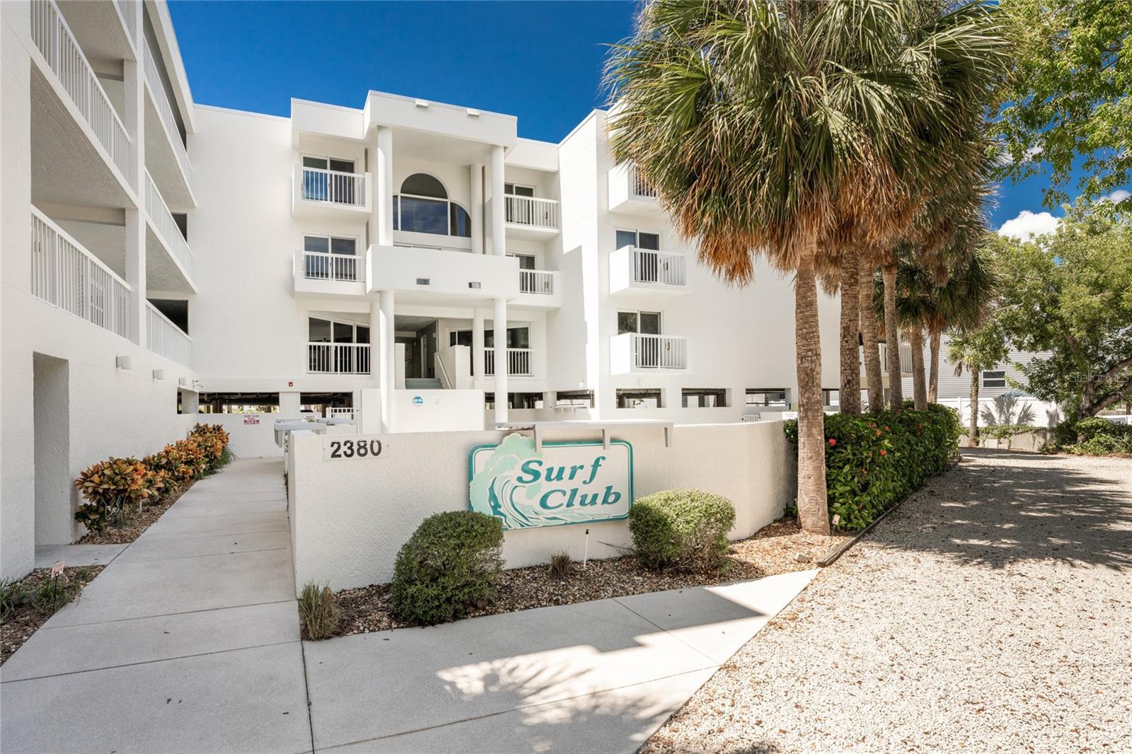 Welcome to this lovely turnkey-furnished 2-bedroom, 2-bathroom residence at Surf Club Condominiums, a 31-unit community on the sandy shores of Manasota Key in Englewood, Florida. Unit offers a spacious split-bedroom layout designed for comfort and privacy. Step onto the covered balcony—an ideal spot to enjoy your morning coffee or unwind in the evening. The bright eat-in kitchen features granite countertops, tile backsplash, and some stainless-steel appliances, perfect for everyday living. The Primary Bedroom suite offers direct access to the main balcony and an additional private balcony, plus a walk-in closet and an en-suite bathroom with double vanities, a walk-in shower, and a separate soaking tub. Additional highlights include storm-rated sliding glass doors throughout, a new A/C system, and a full-size washer and dryer. The unit also comes with two assigned parking spaces—one covered, one open. Surf Club residents enjoy access to a heated community pool, community room, elevator access, and a private boardwalk leading to nearly 200 feet of pristine beach frontage. Ideally located near island dining, shopping, and entertainment, this home is your perfect coastal retreat. Experience the best of beachside living—your slice of paradise awaits.