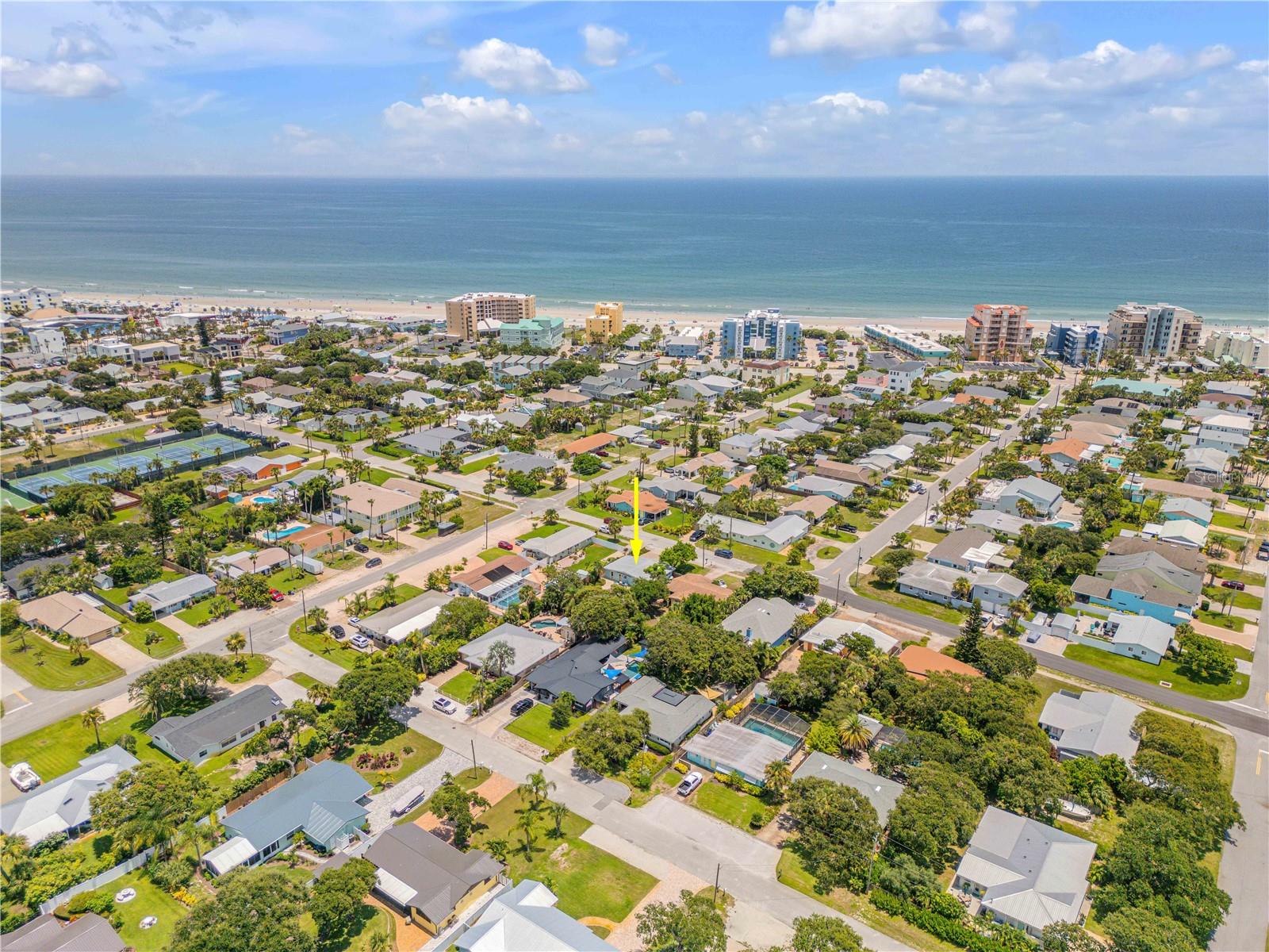 Move-in ready Beachside 3 bd, 2 ba, pool home. Just a few blocks to Flagler Avenue, one block to the beautiful beach. The fenced backyard has a salt water pool and spa surrounded by tropical mature landscaping, fire features, water fountain, fire pit, and roll out sun shade so you can enjoy the suns rays on cooler days and relief on warmer days. Fire pit, fire feature, gas grill and stove are all directly fed by the natural gas hookup. This stunningly remodeled home has terrazzo floors that have been restored meticulously retaining the beachside charm. Plantation shutters. Gorgeous kitchen with subway tile back splash, natural gas stove, granite counter tops, under counter lighting, stainless steel appliances, can lighting, all center around a beautiful custom blown glass light over the center kitchen island. Indoor laundry room with work area. Metal roof. 3/4 of the garage has been fully finished as an art studio which can be a home office or a 3rd bedroom. The remainder of the garage is could be used bikes, storage and yard equipment. Schedule your appt. today so you do not miss your opportunity to experience this home. Easy to show!