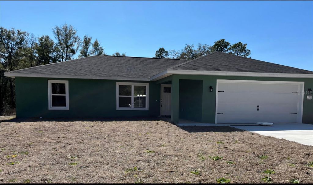 Photo of 10304 SE 126th Lane, Belleview, FL 34420 (MLS # OM718948)