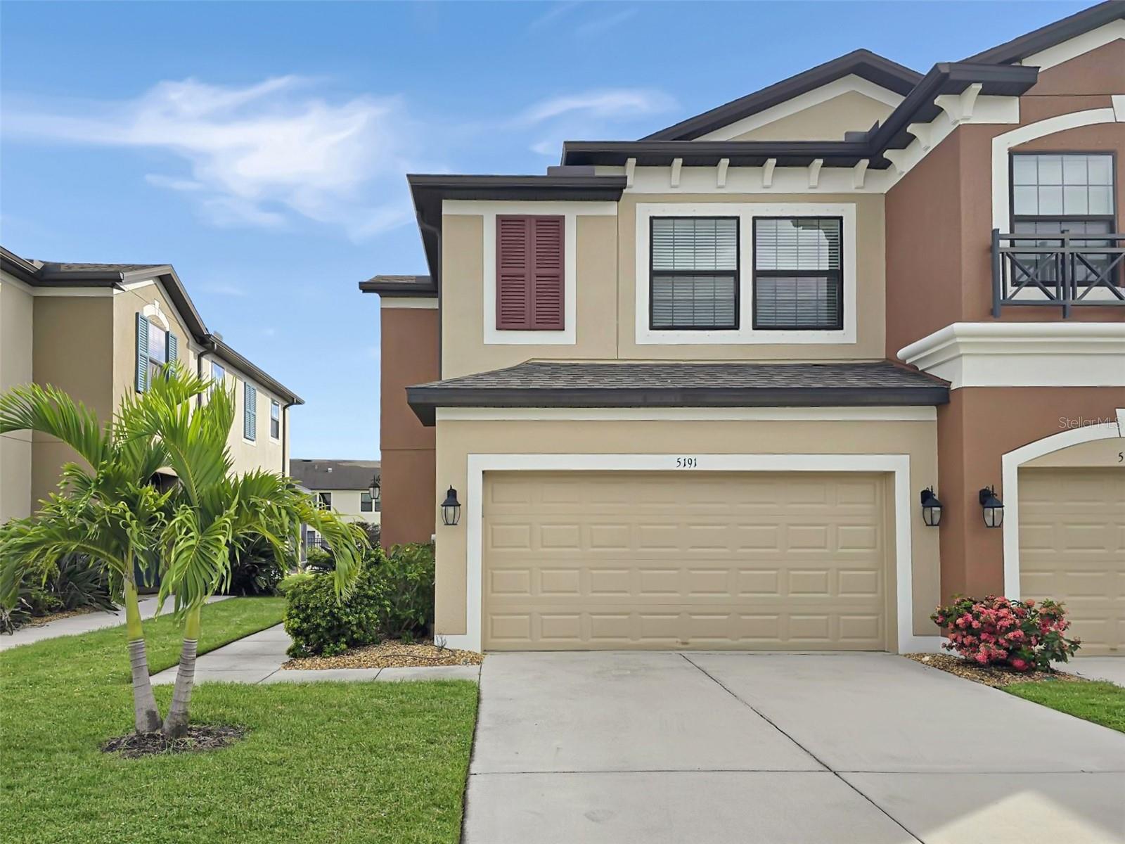 Annual unfurnished three-bedroom, two-and-a-half-bath townhome with a two-car garage, offering 2,153 square feet of well-planned living space in the gated Creekwood Townhomes community. As you step inside, a wide and welcoming foyer leads you into the heart of the home. The kitchen offers upgraded premium appliances, including a European convection oven, a Smart Flex refrigerator, and an 800 series dishwasher. With its large island, abundant counter space, and plenty of cabinetry, it’s designed to handle everything from quick weekday meals to entertaining friends. Adjacent to the kitchen are the dining area and a spacious living room, which opens through sliding glass doors to a covered lanai. From here, enjoy a private outdoor lanai overlooking the community pool perfect for morning coffee or relaxing evenings. The first floor also includes a laundry room, a half bath, and direct 2- car garage access for added convenience. Upstairs, you’ll find a versatile bonus space ideal for a home office, playroom, or media area. Two guest bedrooms with walk-in closets share a full bathroom, while the primary suite sits across the hall as a private escape. The primary bedroom offers a large walk-in closet and a spa-like bath with dual sinks and a glass-enclosed shower. This townhome offers over 100k in upgrades with light fixtures, appliances and window treatments, plus water filtration system, water purifier and a water softener. Creekwood Townhomes provides residents with secure gated entry and resort-style amenities, including the sparkling pool right outside your door. Convenient location just minutes to shopping, dining, SRQ Airport, I-75, Lakewood Ranch, Downtown Sarasota, excellent schools, and medical centers. This home is available for an immediate move in after Gulf Coast approval and Association approval.