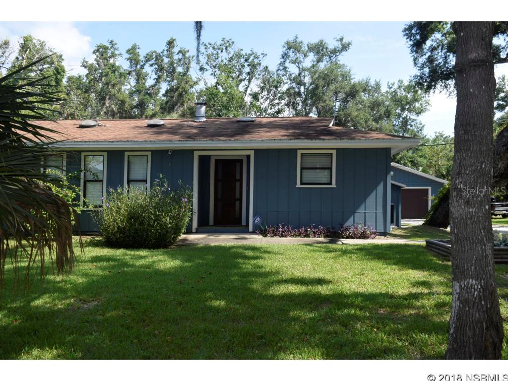 OVER 1/2 ACRE BETWEEN U.S. 1 AND THE RIVER, WITH COMMUNITY BOAT RAMP AND FISHING PIER. THIS LOVELY PROPERTY IS MOVE IN READY AND HAS A GREAT SETTING. LARGE PALM TREES AND A TIDAL CANAL BORDER THE PROPERTY WHICH IS ONLY A FEW HUNDRED FEET FROM THE COMMUNITY BOAT RAMP. BEAUTIFUL WOOD PLANK PORCELAIN TILE AND GROUT-LESS MARBLE TILE GIVE BEAUTY AS WELL AS EASY MAINTENANCE TO THIS PROPERTY. ALL NEW KITCHEN APPLIANCES AND CABINETS WITH PLENTY OF COUNTER AND STORAGE SPACE. ALL NEW BATHROOM FIXTURES, VANITIES, TOILETS AND SHOWER ENCLOSURES. THE MASTER BEDROOM HAS A LARGE OVERSIZED WALK IN, AND SPACIOUS MASTER BATH. THIS IS A SPLIT FLOOR PLAN WITH ALL THE MAIN OPEN FLOOR PLAN IN THE MIDDLE. WELCOMING ENTRANCE FOYER AND COVERED FRONT PORCH. FLORIDA ROOM IS LARGE WITH OPEN WINDOWS TO VIEW THE TROPICAL BACK YARD. THE TWO CAR OVERSIZED GARAGE HAS A GARAGE DOOR IN THE FRONT AND A GARAGE DOOR IN THE BACK SO YOU CAN LITERALLY DRIVE THROUGH THE GARAGE. A STORAGE SHED/WORKSHOP ON THE PROPERTY COULD BE AN ART STUDIO OR A KIDS PLAYHOUSE. NEW ROOF, NEW HEAT & AIR AND A TERMITE BOND MAKE THIS THE PERFECT MOVE IN READY HOME TO OWN. (TWO PARCELS MAKE ONE SALE 841205000310 & 841205000340) ;Water: City
