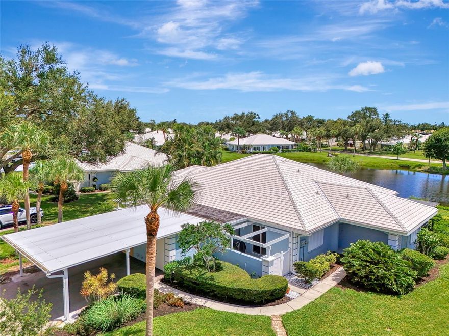 Wonderful Waterfront Views in Beautiful Augusta Villas in Plantation! Not one but two separate lake views PLUS the fantastic planation golf course just beyond makes this villa among the best views in all of Augusta Villas. This 3 bedroom, 2 bathroom home is currently setup with one of the bedrooms extending the living area, giving you additional lighting and living space. The primary bedroom is unique featuring an additional den/office, or flex space. This space serves as an added benefit by connecting the previously detached laundry room directly to the interior of the home for added convenience. The primary bedroom features an updated en-suite bath with dual vanities and sinks, a walk-in roman style shower, plus a large walk-in closet. Updated kitchen with granite counters and stainless-steel fridge, hood, and oven. Fantastic water views from your screened lanai area, and from the main living area. Unique front gated porch area with pergola gives you lots of additional outdoor living space. Conveniently located close to Wellen Park, Historic Downtown Venice, and Gulf Coast Beaches. The Augusta Villas community features two community pools, included lawn maintenance, and exterior home maintenance including roof replacement and cleaning. Optional golf, social, or fitness membership to the Plantation Golf and Country Club just down the road. Come and see this wonderful home today!