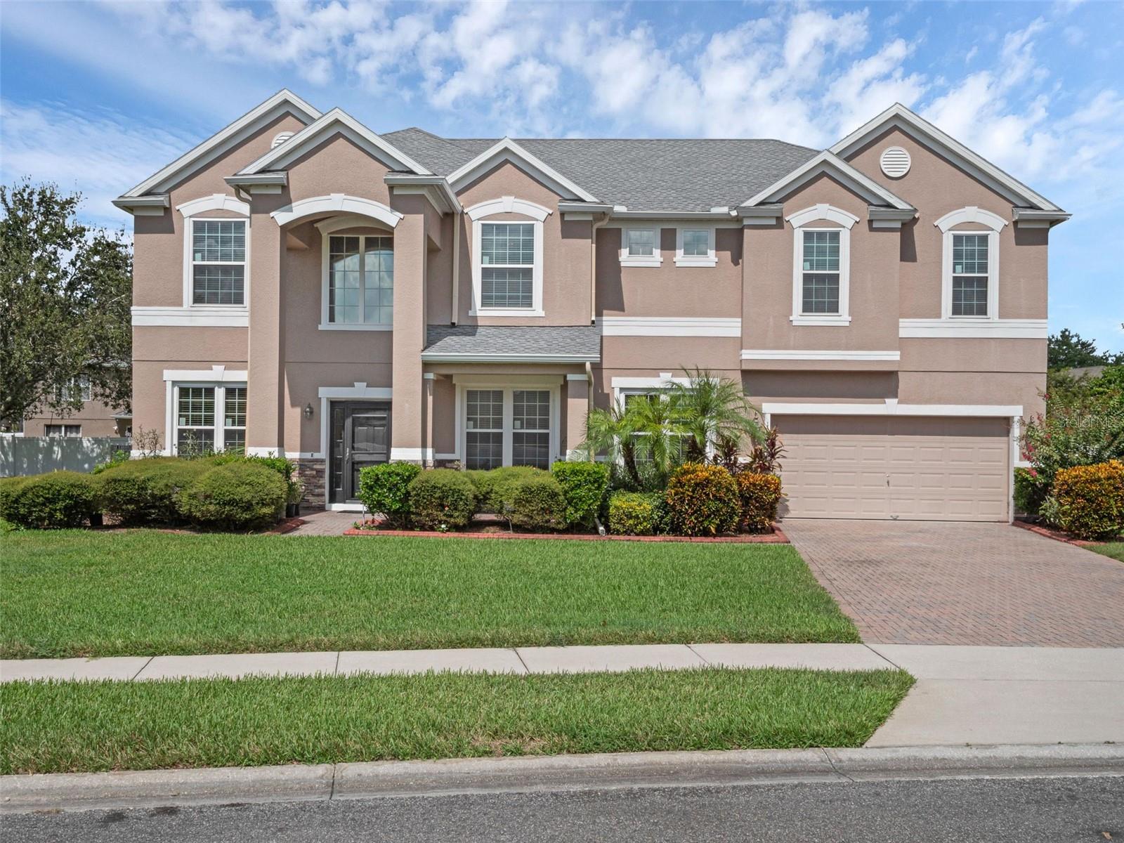 Welcome to the pristine and highly sought-after Belle Meade community! This impressive 7BR/4BA home offers over 4,400 sq ft of living space with oversized bedrooms and tall ceilings upstairs and down. The upstairs bonus room includes its own bar, while the AC-cooled sunroom is perfect for year-round enjoyment. The fully fenced backyard sits on more than ¼ acre and features two mature mango trees. Recent updates provide peace of mind with a new roof (2023), new windows, a whole-house water filtration system, and paid-off solar panels.
Families will appreciate the top-rated school zoning—Whispering Oak Elementary, Sunridge Middle, and West Orange High—plus the benefit of being just across from Foundation Academy, one of Winter Garden’s premier private schools. For recreation, West Orange Country Club is only a mile away, offering golf, tennis, and more.
All of this in a central location near historic Downtown Winter Garden, Winter Garden Village, Hamlin, and New Independence shopping/dining, with easy access to Disney, Universal, Orlando International Airport, and major highways (429, Turnpike, 408). This home truly has it all—schedule your showing today!