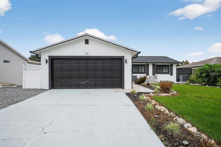 Set in a non-flood zone just minutes from Indian Rocks Beach, this beautifully renovated 3 bedroom, 2 bathroom, 2-car garage home delivers modern style and peace-of-mind updates from front door to backyard. An open floor plan connects living, dining, and kitchen spaces and brings in great natural light. 

Tile floors run throughout for a clean, low-maintenance finish, and recessed LED lighting brightens the living room and kitchen. The kitchen is the full package featuring new cabinetry, premium countertops, a stylish backsplash, stainless steel appliances, 2 barstool overhangs, and even pot filler!

The primary suite offers a refined bathroom featuring a glass-enclosed walk-in shower with a built-in niche and shower bench, plus a dual-sink vanity. The second bathroom is also newly finished with quality tile work, a sleek vanity, and luxurious finishes.
Out back, a fenced yard provides plenty of space for pets and play, along with a paver patio, a built-in outdoor fireplace, and a hot tub for relaxed evenings or weekend get-togethers.

Big updates in 2024 include: Roof, Electrical panel, HVAC ducts, Water heater, and more! 

This quiet neighborhood offers quick access to beaches, parks, golf, dining, and everyday errands while maintaining a relaxed residential feel. Tour today to experience a move-in-ready coastal home with quality finishes and thoughtful updates.