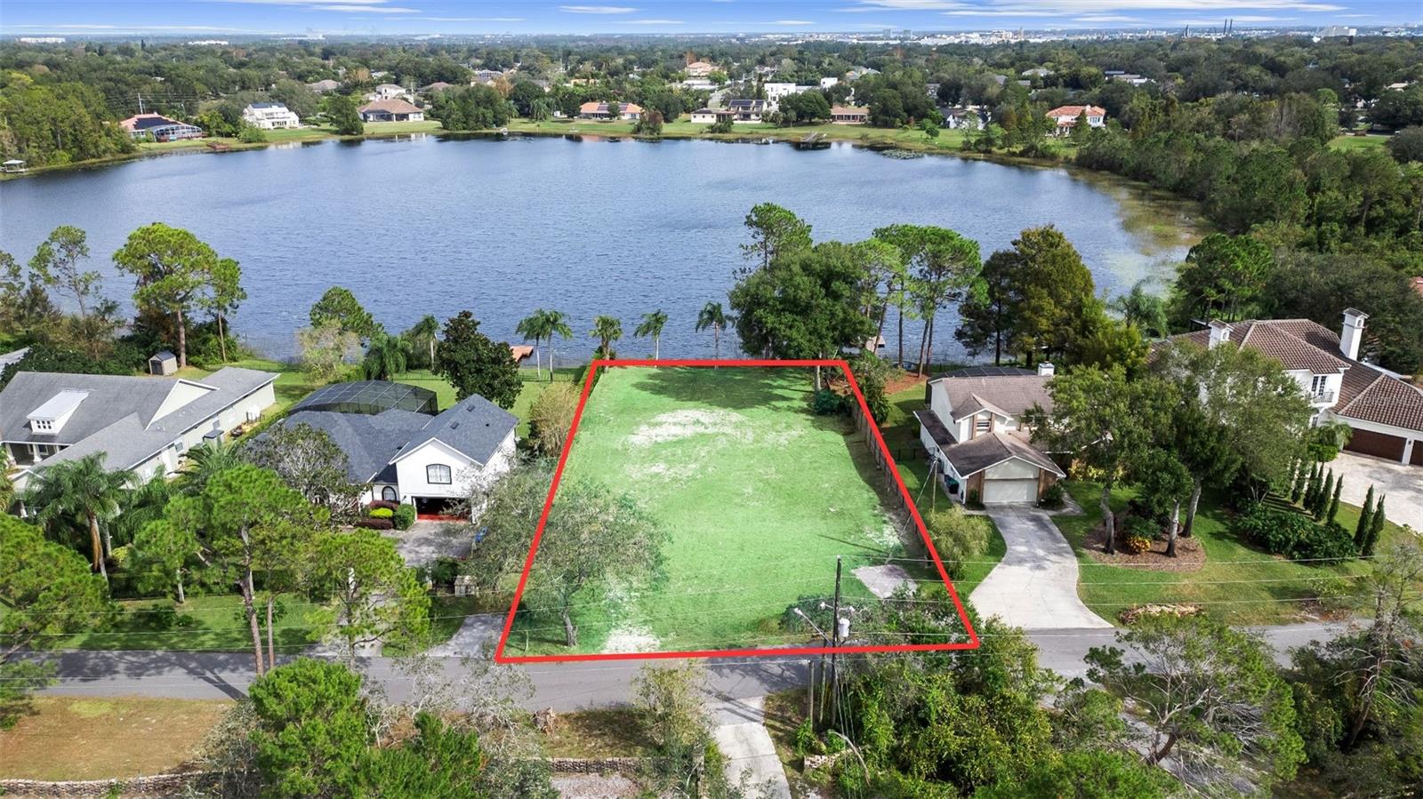 Rare opportunity to purchase vacant lakefront land at the heart of Dr. Phillips in Orlando! This exceptional half-acre property boasts over 90 feet of direct frontage on the serene, spring-fed Palm Lake, offering unobstructed views of the lake. Palm Lake is ideal for kayaking, paddle boarding, and bass fishing. Nestled on a quiet residential cul-de-sac in the established Palm Lake Manor community, this lot requires no clearing and there’s no HOA to worry about. Enjoy the peace and quiet of the neighborhood, surrounded by other beautiful homes. Conveniently located just minutes from Bay Hill Club and Lodge, Universal Studios, Islands of Adventure, Volcano Bay, Sand Lake Road’s restaurant row, International Drive, and downtown Windermere. Don’t miss this chance to buy your piece of lakefront land in Dr. Phillips Florida!