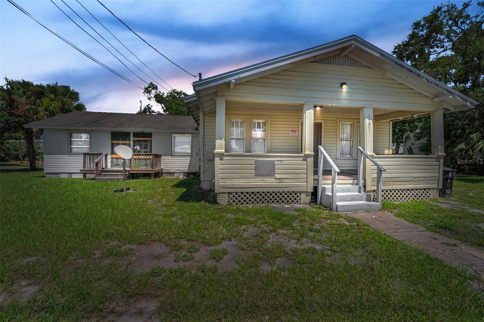 Live the Clearwater dream with this unique 5-bedroom, 2-bath home situated on an oversized corner lot in the highly desirable Edgewater Corridor. Just steps from the Pinellas Trail and minutes from Downtown Clearwater, Downtown Dunedin, and Clearwater Beach, this property blends Old Florida charm with modern opportunity. Its flexible layout and spacious lot make it ideal for a mother-in-law suite, home office, or future expansion. Zoned 0752-ALF (Boarding House – less than 10 units), it presents strong potential for residential or mixed-use commercial redevelopment. Investors will appreciate the detached laundry room with two coin-operated washer and dryers, along with key updates including a newer roof, a gas water heater, and a new A/C system in 2021. Whether you’re looking to live, invest, or redevelop, this property offers location, flexibility, and long-term value.