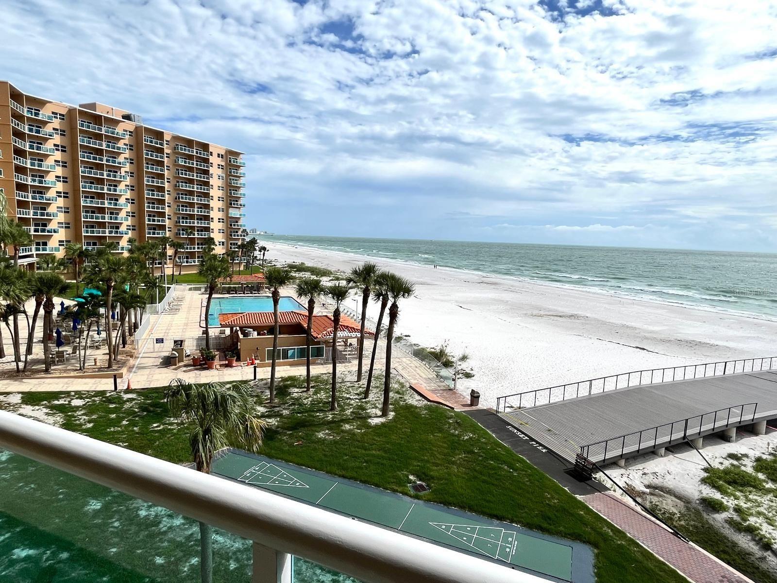 AMAZING LOCATION in the sought after gated REGATTA BEACH CLUB, the last BEACHFRONT BUILDING on NORTH CLEARWATER BEACH.
Don’t miss this rarely available beach-facing and spacious 3rd FLOOR STUDIO OVERLOOKING DIRECTLY OUT ONTO CLEARWATER BEACH.
This condo has plenty of natural light and opens through sliding doors into its large balcony offering expansive, unobstructed views of the Gulf, Beach and beautiful pool area. You will be amazed by the MOST MAGIFICENT SUNSETS right from your balcony, accompanied by the peaceful sound of waves rolling in.
This studio has been NICELY UPGRADED and comes FULLY FURNISHED including a top-of-the-line Murphy bed in the great room, lot of closet space, electric shades, neutral tile flooring throughout. .
The studio features a large built-in island table with gorgeous Cambria Quartz with plenty of seating offering lot of work or entertainment space.
The renovated kitchen has white cabinetry, stainless steel appliances, a desk/breakfast bar, and same beautiful Cambria Quartz countertops and backsplash.
In the spacious bathroom, you will find the same Cambria Quartz countertops as well and a beautiful large shower.
The highly desirable North Beach location of this community provides the ultimate vacation experience, as a weekend getaway or second home. or as your permanent vacation residence.
You will enjoy the pristine sugar sand of this quiet North Beach location far from the busy tourist beach. Or you can choose to relax around the beautiful pool area. You can also take a lovely walk north towards Caladesi State Park, or south towards Pier 60 and all the wonderful Clearwater Beach restaurants and attractions. Clearwater Beach has been voted many times #1 beach in the country.
The community offers an Olympic size heated pool directly on the Gulf side, pool deck with barbecue areas, complete fitness center, social room, game room with table tennis and pool table, a spacious Community room with kitchen, a 13 seat Movie theater, Bicycle & Kayak Storage room, Workshop, EV Charging stations and Car wash facilities. The community grounds are always kept immaculate with daily maintenance, 24hr security and plenty of parking.
The beach trolley stops in front of the property and is a great way to enjoy all Clearwater Beach has to offer: restaurants, nightlife, shopping, charter boat fishing, dinner cruises, sightseeing tours, dolphin spotting tours, pirate ship, daily sunsets at pier 60 with artisans, crafters, as well as musical entertainment.
Live the Resort lifestyle of this unique beachfront retreat nestled along the pristine shores of Clearwater beach.
You will always feel like you are on vacation in this remote paradise!!
And when you aren’t soaking up the sun at your new beach condo, you can earn extra income with your investment by renting it out for others to enjoy! (90-day min lease period, always in high demand for seasonal rent).
Call today to schedule your private showing