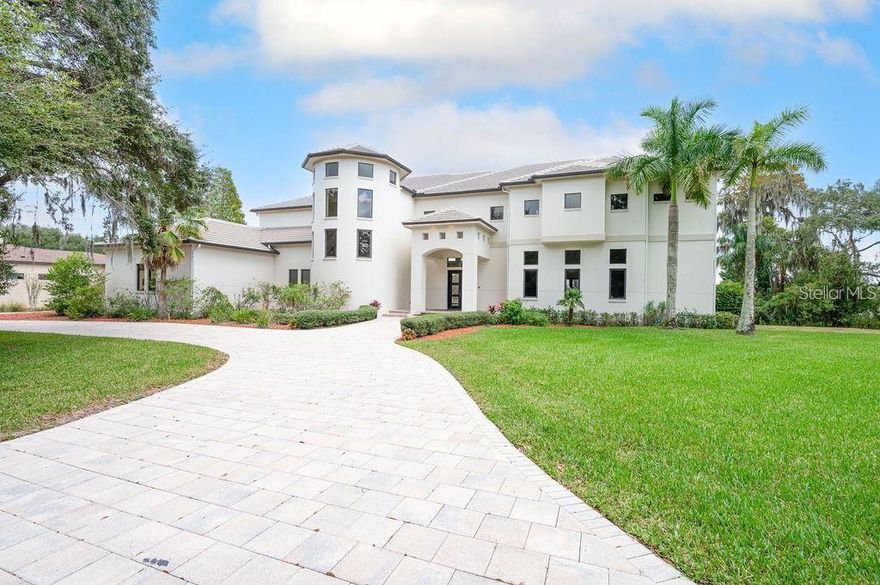 What an opportunity to own this UNIQUE masterpiece in Keystone Shores Estate! This estate homes features 4 Bedroom 4.5 Bath and has a study with a Library overlooking one of Odessa's most tranquil lakes. Imagine sitting on the private dock to enjoy sunrise and sunsets on this pristine lake up close. This home has a saltwater pool and spa with very large open travertine covered decking, outdoor kitchen that is great for entertaining The Kitchen features granite counters, Dual Bosch dishwashers, Wolf range and Wolf double ovens, and Subzero refrigerator. This home has multicolored lighted pool, home automation control by Crestron and LED Lighting, for the ultimate energy efficiency. Sometimes a rare opportunity comes along...and Keystone Shores is just that. Here you will find timeless beauty, magnificent, wooded landscapes and two pristine, sparkling lakes. Keystone Shores retains elements of traditional elegance and beauty. The community is limited to just 36 one-acre or larger distinctive lakeside estates. Enjoy the nature, serenity and the two sparkling pristine lakes of Keystone Shores. Stroll along the rustic path to the community dock, fish in the crystal-clear waters of Little Lake, as well as the quiet and serene neighborhood. At keystone Shores, you can ride bikes to the park and playground, enjoy a game of tennis or playing hoops at the basketball court or simply picnic under the shaded trees in the community park. Come see for yourself!