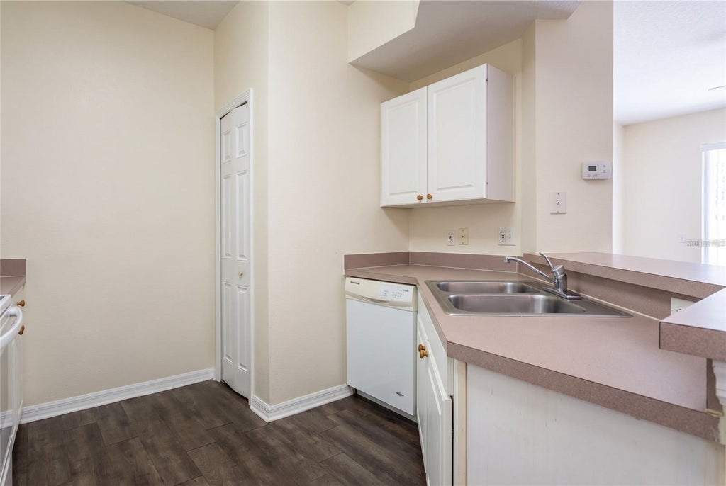 Photo of 5500 Metrowest Boulevard #211, Orlando, FL 32811 (MLS # O6436262)