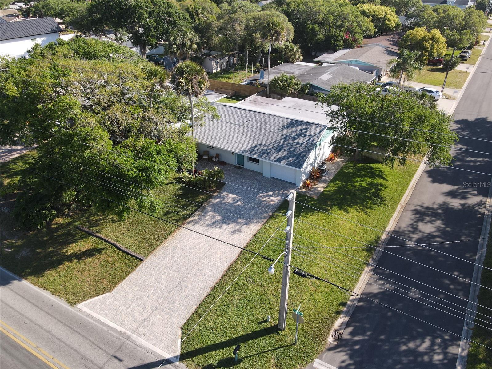 Stunning like NEW 3 Bed 2 Bath block home just a short walk to the beach and close to all beachside amenities with NSB bike path directly across the street. This home offers plenty of parking and has been meticulously renovated throughout with all major systems updated. The large kitchen island with plenty of seating and storage is perfect for entertaining and is the heart of this amazing home. Gorgeous bay window looking west from the living room allows you to enjoy colorful sunsets. The fully fenced back yard with shaded patio is private and great for grilling out and entertaining! Located just minutes from Flagler Avenue and the hottest New Smyrna Beach entertainment, shopping and dining!