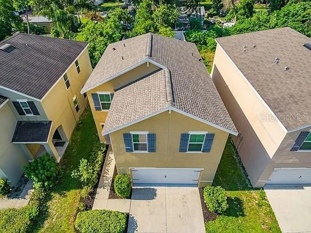 Photo of 10201 Hawk Storm Avenue, Tampa, FL 33610 (MLS # O6353650)