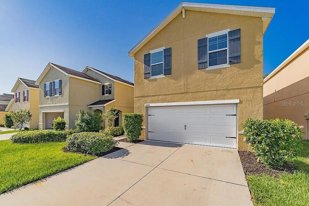 Photo of 10201 Hawk Storm Avenue, Tampa, FL 33610 (MLS # O6353650)