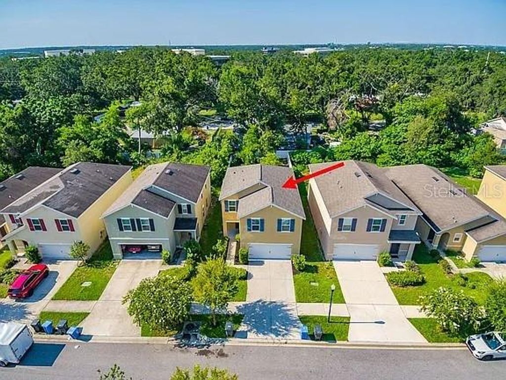Photo of 10201 Hawk Storm Avenue, Tampa, FL 33610 (MLS # O6353650)