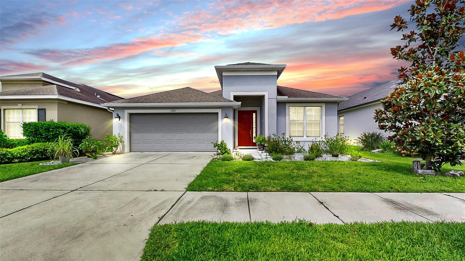 Welcome to the Enclave at Channing Park! NO CDD! Located in a desirable area and Zoned for ALL A-RATED SCHOOLS! This home features 3 bedrooms, 2 bathrooms, and a 2-car garage. Inside, the home showcases a modern open concept floorplan with over 2,000 square feet, and split bedrooms. HIGH CEILINGS AND TILE FLOORS THROUGHOUT! Next to the entryway is an open formal dining room, which can easily be utilized as an office or flex space, as well as a center rotunda leading into the kitchen and family room. The kitchen features include STONE COUNTER TOPS, BEAUTIFUL GLASS TILE BACKSPLASH, STAINLESS-STEEL APPLIANCES (with a brand-new dishwasher), BREAKFAST BAR, KITCHEN RO SYSTEM, AND SPACIOUS EATING AREA! The owner's suite has plenty of natural light and a WALK-IN CLOSET, with the Ensuite bathroom including a DOUBLE SINK VANITY WITH STONE COUNTERS, GARDEN TUB, AND SEPARATE TILED WALK-IN SHOWER! Outside, is a SCREEND IN LANAI, AMPLE YARD SPACE, AND A PRIVACY FENCE, with triple sliding glass door leading to the lanai! *EV Charger, water softener, and smart LED lights in all rooms * Don't miss out on this one, call today to schedule a private viewing!