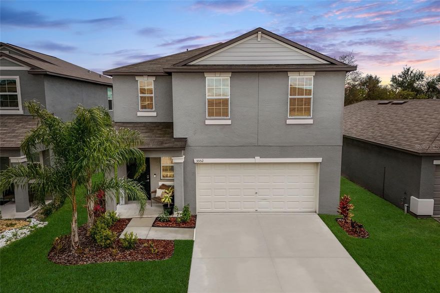 Get ready to fall head over heels for this better-than-new, beautifully upgraded, and move-in ready 4 bedroom home in the highly sought-after Berry Bay community. Perfectly positioned on a picturesque nature lot with no rear neighbors, this home offers rare privacy and serene views, with designer-inspired finishes that truly make it stand out from the rest. From the moment you arrive, you'll be wowed by the immaculate curb appeal and custom lush landscaping. Step through the front door into a light-filled, soaring foyer that immediately makes a statement. Gorgeous custom woodwork and upgraded wrought iron railings replace the standard builder half wall, creating a dramatic, open staircase that draws your eye upward and elevates the entire space. The downstairs hallway opens to an expansive Great Room and oversized kitchen that flows effortlessly into the dining area. The generous proportions and effortless flow make everyday living comfortable while providing the perfect backdrop for hosting everything from elegant dinner parties to lively holiday celebrations. The kitchen is designed to impress, featuring rich espresso cabinetry, gleaming granite countertops, stainless steel appliances, a large island with seating, a convenient single-bowl sink, and a generous corner pantry. Whether hosting holidays or casual dinners, the oversized dining space adapts effortlessly to your lifestyle. Sliders from the gathering room open to the lanai, where you can enjoy beautiful nature views of your huge backyard with a tree-lined backdrop, offering the perfect escape and total privacy. The expansive backyard offers endless possibilities, with plenty of room to add a pool, create a private retreat designed for pure relaxation, or design the ultimate outdoor entertaining space - all while soaking up the Florida sunshine. Upstairs, the versatile loft is the perfect flex space to use as a den, home office, playroom, or home gym. Just beyond, escape to your customized Primary Retreat. The designer accent walls and custom woodwork add character and sophistication, while the generous layout offers a true sense of comfort and relaxation. The en-suite bathroom includes a massive walk-in closet, dual undermount sinks with granite countertops, a walk-in shower, private water closet, and linen closet. Three generously sized secondary bedrooms are thoughtfully tucked down the hall, sharing a full bath with granite counters. The spacious upstairs laundry room with washer and dryer included is perfectly positioned near all bedrooms, making laundry day a breeze. And for the convenience of your guests, a half bath is situated on the first floor, just off the main hallway. Additional notable features to this exquisite home include keypad front door lock; smart MyQ garage door opener; smart video doorbell; in-ground sprinkler system; and hurricane shutters. Located just minutes from shopping & dining, Berry Bay offers exceptional amenities for the active lifestyle including a clubhouse, resort style pool with beach entry, pickleball & basketball courts, large playground, dog park, and picnic pavilion. Nature enthusiasts will love being across from Little Manatee River State Park for hiking, kayaking, and exploring, while beach lovers will appreciate that Southshore Bay’s lagoon is just a short drive away. Quick & easy access to US-301 and I-75, with both HCA South Shore and St. Joseph's Hospital South less than 10 miles away, and an easy commute to MacDill AFB.