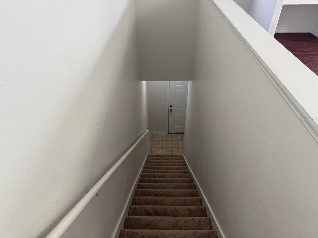 Photo of 6593 Queens Borough Avenue #201, Orlando, FL 32835 (MLS # O6451377)