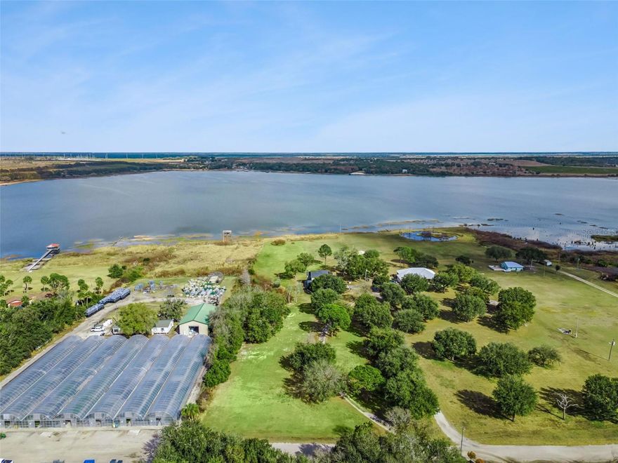 Looking for a lakefront home with acreage in Central Florida where you can escape the noise of city life? Welcome to a peaceful retreat at 1256 Center St in Lake Wales, set on approximately 8.51 beautiful acres of lakefront land where privacy, nature, and wide-open space create a setting that feels worlds away from the hustle of town. Imagine mornings with coffee overlooking the water, afternoons watching wildlife move across the property, and evenings where the sky turns orange and pink as the sun sets across the lake. A portion of your lot sits across the street and is zoned for horses and other livestock for your enjoyment. The current owners love watching the rocket launches that happen directly across Lake Annie. Looking to grow a vegetable or herb garden? Your friendly neighbor Bonnie Plants can help you out since their nursery delivers to retailers like Lowe's and Home Depot. Properties like this offer the kind of lifestyle many buyers dream about but rarely find. Homes with acreage and lake frontage in Lake Wales and Polk County are increasingly hard to come by, especially those that provide both space and water in one setting. Inside, the home offers warm and inviting living spaces filled with natural light, with large windows that bring the outdoors in and provide constant views of the surrounding land and water. The layout makes it easy to host family gatherings, relax with friends, or simply enjoy the quiet beauty of the landscape. Step outside and the lifestyle truly opens up. With 8.51 acres to explore, there is room to garden, entertain, watch wildlife, or simply enjoy the peace and privacy that comes with owning land. The lakefront setting adds another dimension to everyday living, creating opportunities for fishing, kayaking, and unforgettable sunset evenings by the water. You will also appreciate several key updates including a newer roof installed in 2020, newer flooring, updated HVAC components, copper plumbing lines, and copper electrical wiring. If you have been searching for a Florida lakefront home with acreage where life slows down and nature takes center stage, this is a property you will want to experience in person. Schedule your private showing and come see why this peaceful Lake Wales retreat may be exactly what you have been waiting for.