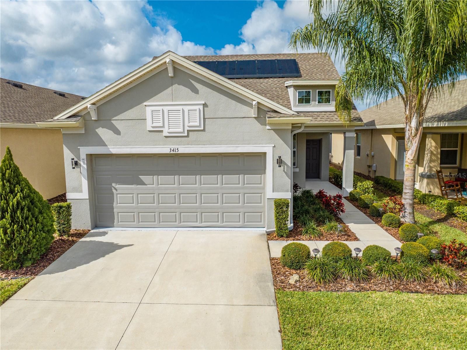 One or more photo(s) has been virtually staged. Virtually staged: Located in the 55+ gated golf cart community of The Lakes at Harmony, this beautifully designed 2-bedroom, 2-bath home with a home office (which can be converted to a 3rd bedroom) offers comfort and low-maintenance living with stunning lake views. The master bedroom overlooks the lake, providing a peaceful retreat. Featuring energy-efficient solar panels, an open floor plan, and a modern kitchen with stainless steel appliances, a spacious island ideal for meal prepping, and ample pantry storage. The primary suite includes a walk-in closet, dual vanities, and a large walk-in shower, while the second bedroom offers privacy for guests.
Enjoy the covered lanai and resort-style community amenities including a zero-entry pool, fitness center, tennis and pickleball courts, walking trails, community garden, dog parks, and golf course—all within this tight-knit community. Outdoor enthusiasts will love the boat and kayak rentals on nearby lakes plus on-site dining options. With easy access to Orlando attractions and Florida beaches, everything you need is right here in the community.
