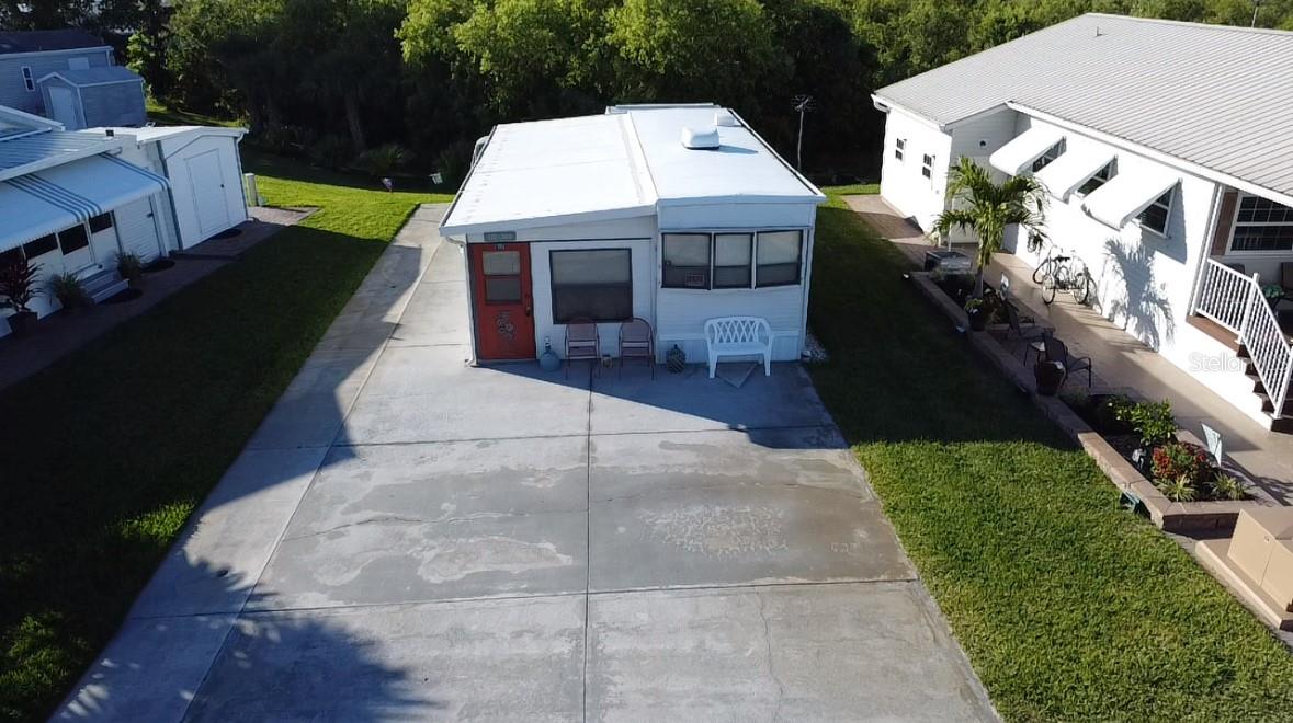 Blue Cypress- Active 55+ Community with Lake Access! This Cozy retreat has 1 Bed , 1 Bath and a 11X31 Florida room. Fully furnished. 8X10 Shed. HOA fee covers lawn maintenance, water, sewer, and trash removal. Community offers heated pool, pickleball courts, shuffleboard, and a 9 hole golf course! All measurements are approximate.