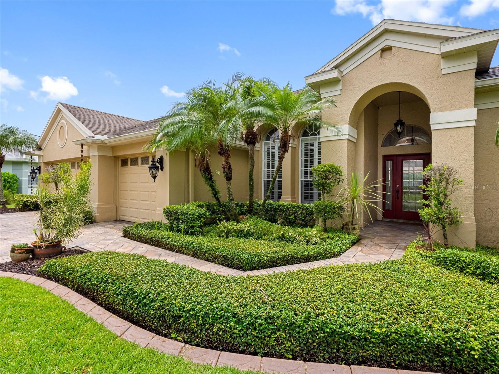 This beautifully updated waterfront pool home offers an exceptional lifestyle in the heart of Westchase's Woodbay neighborhood, combining comfort, privacy, and convenience in one of Florida’s most desirable suburbs. Inside, you'll find a smart four-bedroom, three-bath layout featuring an open-concept great room, elegant dining space, and a modern kitchen with high-end Viking appliances, abundant counter space, and serene views of the screened-in lanai, pool, and pond. The spacious primary suite includes direct lanai access and a private waterside retreat, while a secondary bedroom with its own bath and patio entrance is ideal for guests or multigenerational living. The outdoor area is designed for both relaxation and entertaining, with a heated pool, paver deck, and built-in Paradise Grill. Notable updates include a new AC, pool heater, and pool pump in 2022, a motorized retractable awning and custom backsplash also in 2022, and a roof replacement in 2017. Just steps from Glencliff Park and the Westchase Golf Club, and zoned for top-rated schools, this home offers unmatched access to community amenities including two resort-style pools, tennis and basketball courts, trails, parks, golf, and a lively town center with coffee shops, dining, and boutiques. With quick access to the Veterans Expressway, Westshore District, International Plaza, and Tampa International Airport, this is the perfect blend of lifestyle and location.