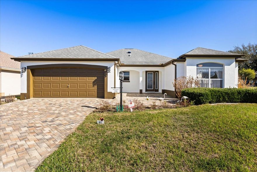 Move-in ready and thoughtfully updated home in the desirable Village of Hacienda East, just minutes from Spanish Springs Town Square. Freshly painted exterior, lead glass front door with matching side panel and a recently sealed paved driveway create welcoming curb appeal. Inside, new flooring enhances the living and dining areas designed for comfortable everyday living and entertaining. The spacious kitchen offers abundant cabinetry, generous workspace, a breakfast nook with bay window and a convenient built-in desk area. The Florida room is 220 square feet with new ceramic tile, closet for extra storage, under heat and air, also is accessible from the living room and owners' retreat, providing additional living space ideal for hobbies, office or relaxation. Split floor plan features a private guest wing with two bedrooms and an upgraded full bath with new Toto commode, new ceramic tile, updated faucets and rain shower head. You will be impressed with the owner's retreat, enter through double doors to an oversized bedroom with double walk-in closets, an en-suite that includes an updated glass shower enclosure with dual rain showerheads and new Toto commode. Conveniently near shopping, dining, golf, entertainment and recreation, this beautifully maintained home offers comfort, functionality and an elevated lifestyle in The Villages.