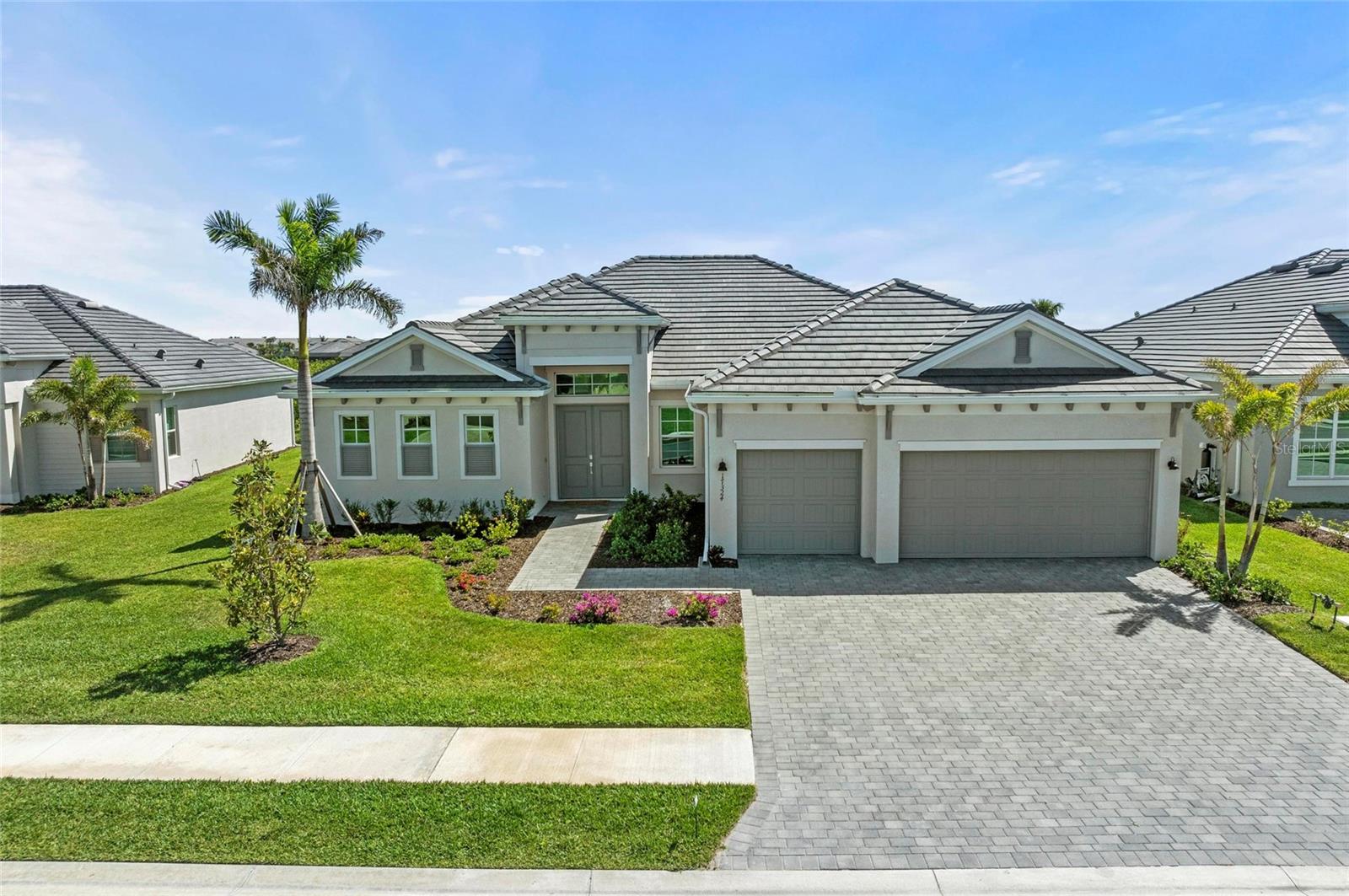 Don’t miss your chance to own the ever-popular Sunset model in the highly sought-after Wellen Park Golf & Country Club, where GOLF membership is included! This nearly new home has been lightly lived in and beautifully refreshed to offer a modern, luxurious feel throughout.
This spacious and thoughtfully designed floor plan by Lennar—one of their most popular—features 3 bedrooms, 3 full bathrooms, and a versatile den, perfect for a home office or additional living space. High-end lighting fixtures, ceiling-height finishes, and ceiling fans in every bedroom enhance the comfort and style of this impeccable home. At the heart of the home, the kitchen impresses with elegant shaker cabinets, sleek white quartz countertops, and brand-new Stainless Steel Whirlpool appliances, all set atop durable 18x18 tile flooring that flows seamlessly throughout. As a golf-deeded property, you'll receive two golf memberships, granting you access to a professional golf shop, driving range, putting and chipping greens, and a world-class 18-hole golf course. The lifestyle doesn't stop there—residents enjoy resort-style amenities including: A state-of-the-art clubhouse, zero-entry pool and spa, fitness center & day spa, tennis, pickleball, and bocce courts, tiki bar & restaurant. Upcoming fine dining experience, dog park and more!
This rare opportunity to live in luxury and leisure won't last long. Schedule your private showing today and start living the Wellen Park dream! The Wellen Park Golf & Country Club is a resort style community complete with an 18-hole golf course, designed by Gordon Lewis surrounded by miles of biking and walking trails. The resort-style amenities include a heated community pool, state of the art fitness and gym center, salon and spa (massages, manicures, facials!), social activities director, tiki bar, tennis and pickleball courts, bocce ball, and dog park. A restaurant is in the works, too! Located near the expanding downtown Wellen Park where you can enjoy bars, restaurants, shopping, farmers markets, live entertainment. Also close by is Cool Today Park, the Atlanta Braves’ spring training center a future boutique hotel!