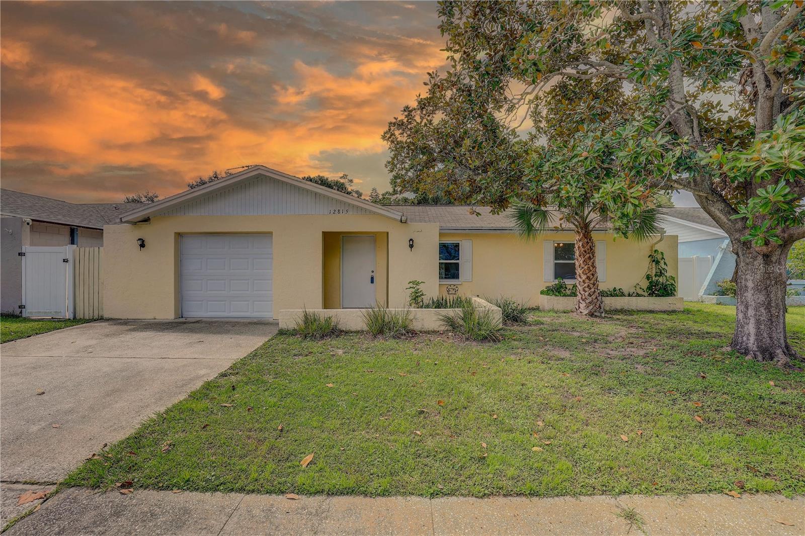 Welcome to 12815 129th Terrace in the sought-after Mill Pond community!
This charming and AFFORDABLE 3-bedroom, 2-bathroom home with a 1-car garage is located in a NON-FLOOD and NON-EVACUATION ZONE—offering peace of mind year-round. This home is MOVE-IN READY and is perfect for FIRST TIME BUYERS or INVESTORS looking for a great rental; this property has previously rented for $2,700/month.
Step inside to a bright and airy living and dining area featuring NEUTRAL tones and easy-to-maintain ceramic tile flooring. The kitchen boasts GRANITE countertops, a pantry, and direct access to the INSIDE UTILITY room for added convenience.
The SPLIT-bedroom layout offers enhanced privacy, and all bedrooms include newer laminate flooring—no carpet throughout.
Off the dining room, French doors open to a spacious ENCLOSED porch, perfect for a home office, playroom, gym, or creative studio. Add a mini split or window unit to turn it into a year-round bonus space. For energy efficiency, there are newer DOUBLE PANE WINDOWS throughout.
BONUS: The Seller will install a new shingle roof prior to closing with a full price offer.
Conveniently located just minutes from Indian Rocks Beach, Publix, Largo Mall, and a variety of local dining spots.
Don’t miss this opportunity—schedule your private showing today!
