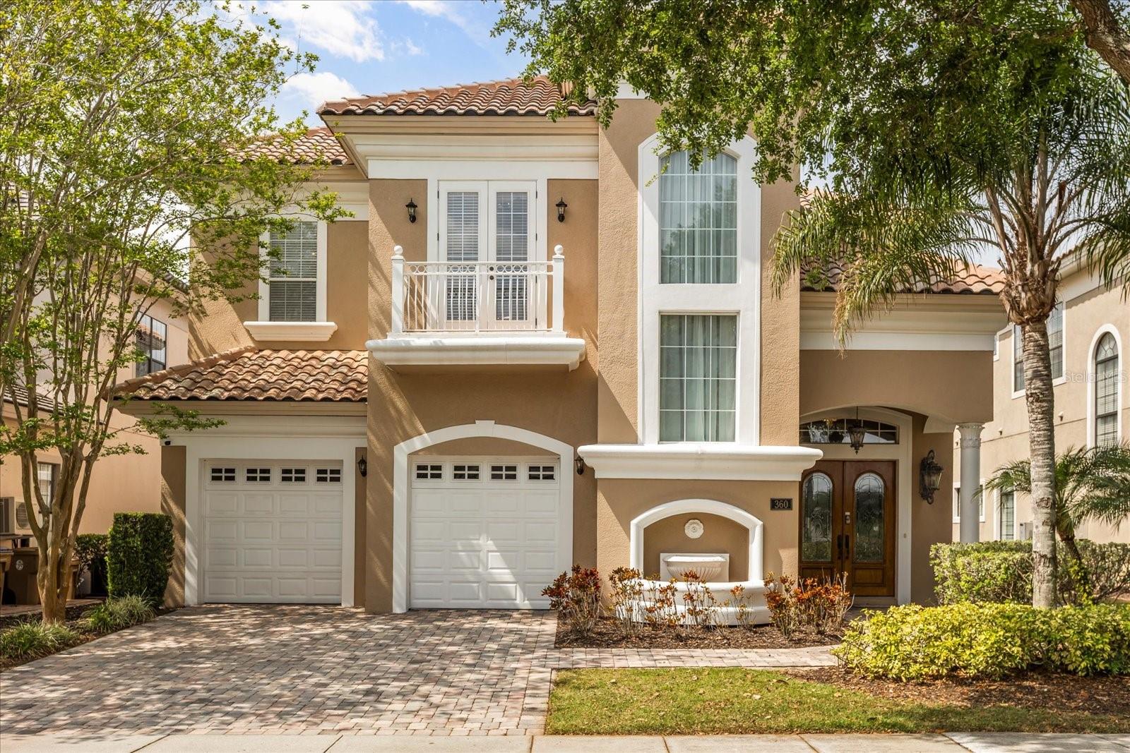 Welcome to 360 Muirfield Loop, an immaculate home that offers stunning GOLF VIEWS of the 10th fairway on the signature Jack Nicklaus course. This professionally decorated FULLY FURNISHED home features high ceilings and a thoughtfully designed layout, creating a space that's as functional as it is beautiful. Upon entering, you are greeted by a spacious living area that includes custom built in shelves with a cozy gas fireplace, seamlessly connecting to the formal dining area which boasts seating for 10 guests and a dual-temperature wine refrigerator. The open-concept design flows into a chef’s kitchen equipped with a large island with seating, stainless appliances, stone countertops and custom hardwood cabinets with crown molding that adds a touch of elegance. Recent updates to include a NEW refrigerator and dishwasher. There is also a charming breakfast nook offers the perfect spot for casual meals. Adjacent to the kitchen is a second living area ideal for relaxing or entertaining. Additionally there is a first floor guest suite that in en suite providing a welcomed sense of privacy for guests. The upstairs features two expansive primary master suites, both with access to a balcony overlooking the expansive pool deck and the golf course. Each primary suite offers dual sinks, a garden tub, a shower, and large walk-in closets providing a private and luxurious retreat. The remaining two guest suites are also en suite and are themed with Princess and Stars Wars decor. There is ceramic tile throughout, NO CARPET that adds a clean, sleek feel, while the hardwood stairs elevate the overall design. Entertainment options abound with a professionally designed, themed game room, complete with arcade games, foosball, a pool table, and a poker table, ensuring fun for all ages. Step outside to the spacious pavered pool deck, where you'll find a covered lanai with a summer kitchen equipped with a BBQ grill, refrigerator, and wet bar. A professionally constructed covered seating area was added and provides the perfect spot for hours of outdoor enjoyment. The saltwater pool and jacuzzi complete this backyard oasis, offering relaxation and entertainment all year round. The laundry room located on the 2nd floor is equipped with a NEW washer and dryer, along with built-in cabinets and a sink for convenience. Additional features include bluetooth surround sound throughout the home and there are also five exterior cameras for added security. This home offers a perfect blend of luxury, comfort, and style, making it the ideal place to live, entertain, and enjoy life to the fullest. Don’t miss the opportunity to make 360 Muirfield Loop your forever home! It is a great opportunity to make this your primary, second home, or investment property! Reunion Resort is a one of a kind 2300 acre Resort and Golf community that has many amenities including a water park complete with water slides, lazy river, zero entry pools & food and beverage service, 3 award-winning golf courses designed by the legends of golf (Palmer, Watson & Nicklaus), 11 pools throughout the community, mini putt putt golf, world class tennis courts, pickleball courts, playgrounds, dog parks, golf cart & bike rentals and several on-site restaurants to include fine dining. Reunion Resort is located just 6 miles to Disney and the parks, and a short drive to the Orlando International Airport