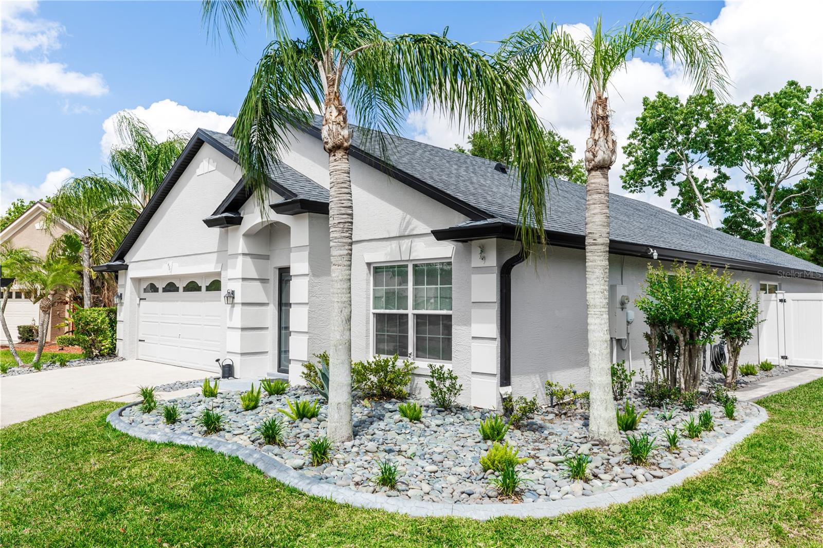 This is a true gem! Beautifully remodeled 3-bedroom Pool Home for Rent in Prime Ocoee Location. Near Windermere, Gotha and Winter Garden! Nestled in the gated Wesmere community, this spacious 3-bedroom, 2-bathroom, 2-car garage, private driveway and refreshing pool is the perfect place to call home and experience the Florida lifestyle. Walk in through a stained-glass entry door to find a spacious foyer and formal living room with high ceilings, fresh neutral paint and newly installed VLP flooring. The kitchen is equipped with appliances, and you will find new gray cabinets, quartz countertops and a large lighted pantry. Enjoy the beautiful Florida weather in your luxurious screened-in pool with double spilling fountain and select the pool lighting color to match your mood! The house is surrounded by beautifully selected landscape with fragrant roses and paved with Mexican river stones to elevate the look and add charm to the view. Both bathrooms have been remodeled with tile floors, modern sinks and bright lighting. The primary bedroom is very spacious and has an amazing California walk-in closet. All Windows have been replaced and come with a sheer privacy rolling shade and room darkening shade. Laundry room with hook up for washer/dryer. This dream house comes connected with smart devices including, wireless light remote control, google thermostat, ring camera and HD security cameras that you can control directly from your phone. Landlord offers a great deal of monthly concessions including pool services, HOA fees, wireless sprinkler system, lawn and landscape services, fertilization and weed control, pest control, Spectrum premium cable and high-speed internet, front and back outdoor security HD cameras with online footage access! Don't miss this opportunity to call this place home! Come see it for yourself! No pets/No subleasing allowed.
