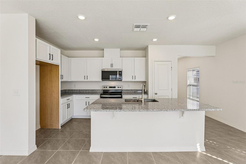 Photo of 387 Sequoia Drive, Lake Wales, FL 33859 (MLS # O6407826)