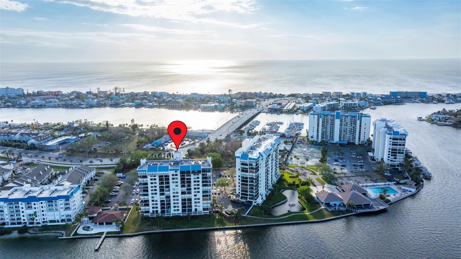 WATERFRONT 2/2/ CORNER UNIT in prestigious Yacht & Tennis Club of St Pete Beach, and easy stroll to our gorgeous Gulf beaches. Located near popular night spots and eateries as well as public transportation. YTC boasts a large waterfront heated pool and spa, 7 HarTru tennis courts, 24/7 manned security, a marina, clubhouse with an active social life, shuffleboard and saunas. This 10th floor unit features an open floor plan and 1430 square feet of space. Enjoy sitting on the wrap around balcony and watching the near daily dolphin performances or catch the near daily sunsets off the front walkway with gorgeous skies and Gulf vistas. Check this one out!