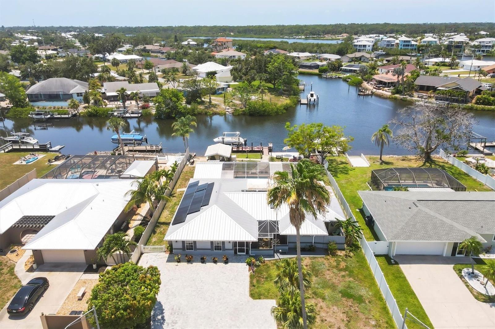 Truly Unique Waterfront property with your own Private Beach area with direct access to the Gulf America (Mexico) a Boaters Paradise. The property is a rare find offering 5 bedrooms and 3 baths in highly sought after Nokomis Florida. Outside features of the home include a large deep pool with diving board, Workshop, both front and rear screened-in patio's, Playground area, sand beach relaxation along with boat dock and lift, making it a Great place for your own backyard Vacations. Other quality updated to this special property include Hurricane impact windows, Metal roof, extended 54x30 paved lanai partially, New septic field 2020, New Paver Driveway 2023, $40,000 in Solar panels (fully paid for) resulting in an average $75 monthly electric bills. This well-built home NEVER Flooded during the hurricanes of 2024. Beautiful water and Sunset views from the Kitchen, Dining, and Family rooms. Enjoy the convenience of being close to A+ Rated schools, shopping, dining and easy access to the New Sarasota Memorial Hospital and I-75, while having a private retreat to call Home. One Year Home Buyers Warranty thru American Home Shield. WELCOME HOME....