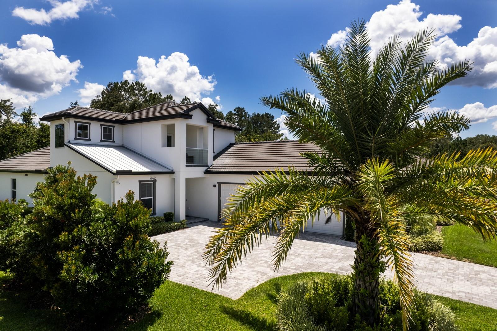 Luxury meets Modern in this simply beautiful home located in Redtail, a gated golf community comprised of Estate Homes. As a Rental this home comes with Social Membership privileges and use of restaurant, tennis courts, gym, and community pool all of which are a short walk from the home. Like new, an open and spacious floor plan designed for entertaining friends and family. Master retreat is a tranquil ending to the day and boast a stunning ensuite with double sinks, large shower, free standing soaker tub plus his & hers walk-in closets. Private office is situated near the front, perfect for working from home. Need a spot for teenager or in laws? The upstairs bedroom provides its own seclusion with office/work out/flex space, generously sized bedroom, full bathroom and it's own balcony. 2 nice sized bedrooms and a full bath plus separate powder room are located on the main floor. The kitchen is a show stopper with a huge center Island countered with quartz and cascading waterfall sides, lots of additional quartz counter space throughout, cooktop and stainless appliances, custom soft-close cabinetry, and a surprise secret walk-in pantry that just keeps going and going. Complete water filtration system inside and out for great tasting water and the health conscious. Kitchen, living room, dining room all flow together and open into the Lanai. Need a little fresh air? The Lanai is a masterpiece of design bring the outdoors in with the perfection of pavers and completely screened for total enjoyment. Garage is oversized easily housing 3 cars and still has room for tools or other needed storage. Location is light on traffic but heavy on getting everywhere! 429 to Orlando or Sanford very easy commute, less that 15 minutes to Mount Dora or Eustis with shopping, medical centers, restaurants, festivals, schools, parks and so much more. Rush to schedule a viewing! This rental in this sought after community will not last, so very special you may never leave.