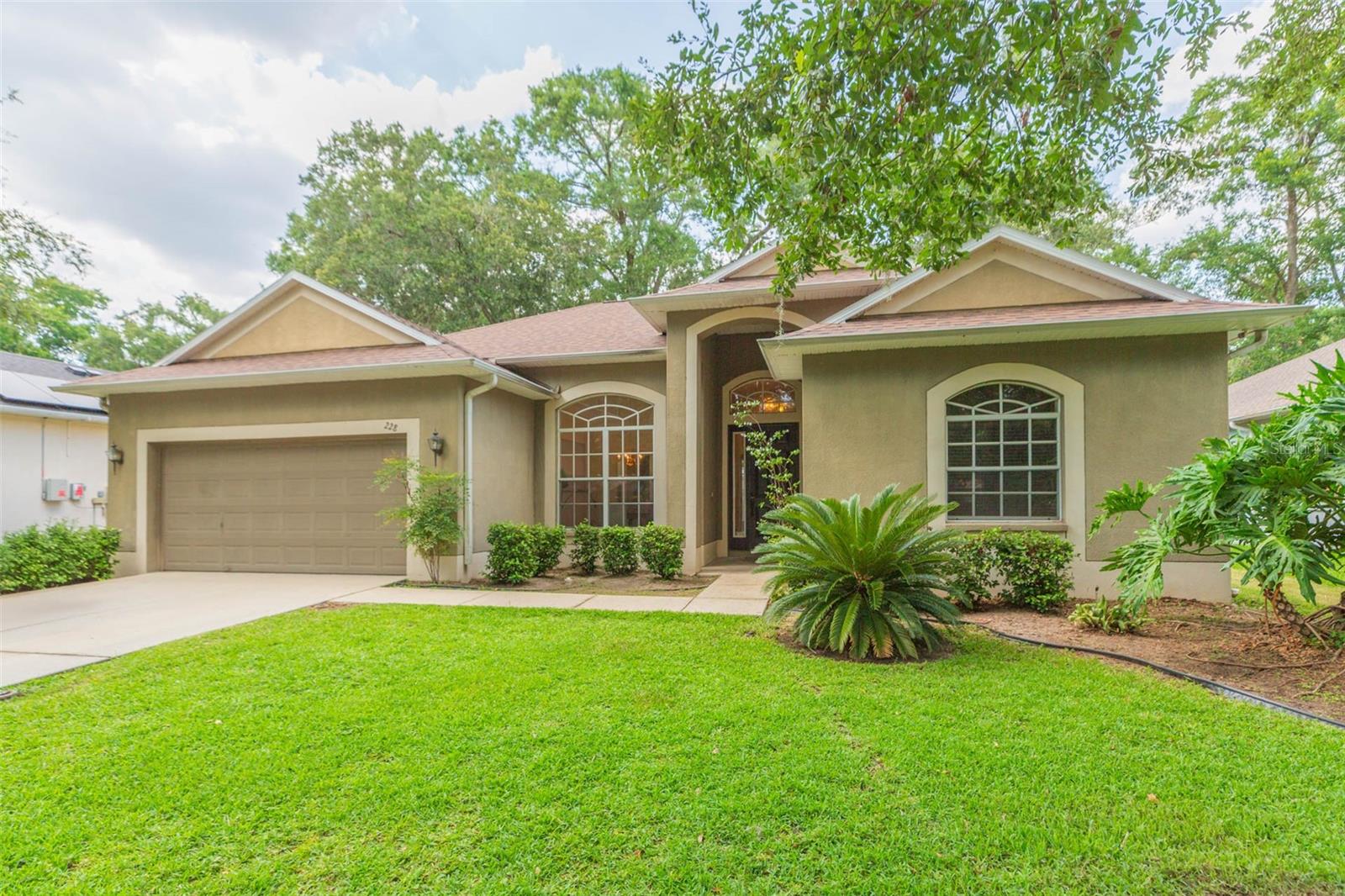 Welcome to your extraordinary new sanctuary! Beautiful 3 Bedroom 2 Bath home with updated flooring nestled on a quiet street in the heart of Brandon. Coming in at 1943 square feet of living space, this large 2-car garage home is surrounded by pristine landscaping. New roof in 2022, updated flooring, and interior paint. As you step inside, you’re greeted by a foyer with high ceilings and updated flooring throughout. The kitchen faces the great room and is perfect for entertaining. The secluded primary suite offers the perfect retreat, featuring dual vanities, luxurious en-suite bathroom and two spacious walk-in closets. Step outside to a tranquil patio space that has a wood plank ceiling, 2 decorative ceiling fans, stone tile floors, ideal for morning coffee, evening breezes, or simply soaking in the serenity of nature with plenty of room for lounging and outdoor dining with views of the backyard, enjoy peaceful mornings or relaxing evenings! Very quiet neighborhood close to schools, DMV, shopping, and great restaurants. Easy commute to I75, Crosstown Expressway, 35 minutes from the Tampa International airport.