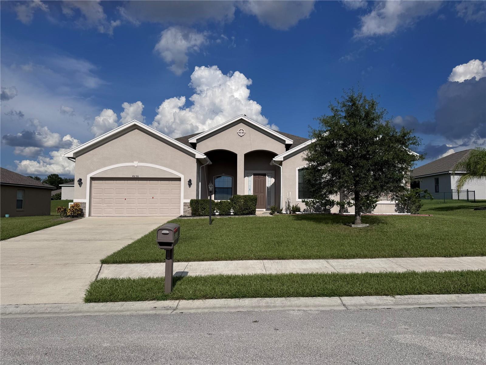 Discover nearly 3,000 sq. ft. of comfort and convenience in this 4-bedroom home with a versatile bonus room and 3 full baths. One bedroom offers the perfect setup for an in-law suite with its own private bath. The enormous kitchen features granite countertops, a spacious island, and comes fully equipped with all appliances—including washer and dryer. Enjoy a generous family room, a screened back porch, and extras like an outdoor shed and a whole-house generator for peace of mind. Located in a secure gated community with playground and sidewalks, this home offers both privacy and amenities. Just minutes from Bok Tower Gardens, Legoland, shopping, cinemas, and only 30 miles from Disney World and 50 miles from the beach—this is Florida living at its best!