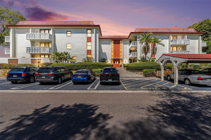 A rare and refined opportunity in Seville, one of Clearwater’s most desirable 55+ communities. This exceptional corner unit offers the privacy and feel of a single-family home with the ease of maintenance-free living. With no neighbors above and soundproof construction below, tranquility is unmatched. Sunlight pours through impact-rated windows and sliding glass doors, illuminating a spacious and flexible layout featuring 2 bedrooms plus office or optional third bedroom. Designed for both comfort and convenience, the home includes a highly coveted in-unit laundry, generous storage throughout, and a full cedar walk-in closet. Dual private balconies invite you to unwind and enjoy peaceful mornings or breezy Florida evenings. Covered parking included along with plenty of guest parking. Seville residents enjoy a true resort lifestyle with a comprehensive monthly fee that includes cable, internet, water, sewer, trash, and full grounds maintenance, along with resort style amenities including oversized pool, fitness center, clubhouse, and vibrant recreational amenities. Perfectly positioned just moments from shopping and dining, just a short drive to the sugar sands of Clearwater Beach and the area’s best attractions, this is effortless Florida living at its finest.