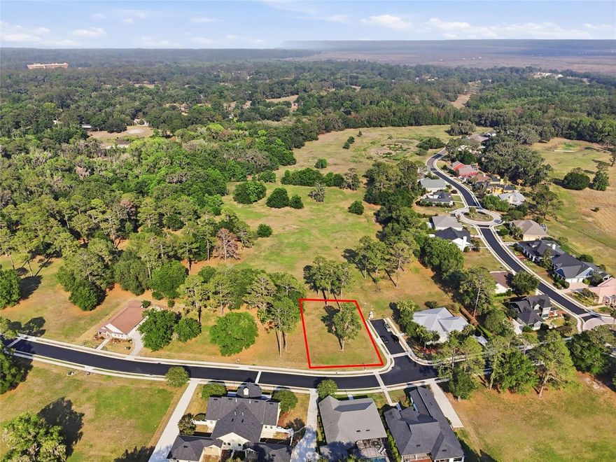 Build the custom home you've always envisioned on this stunning corner lot nestled within the exclusive, gated community of Savanna Pointe. Mature trees dot the landscape, offering natural beauty and privacy. Sip your morning coffee on the front porch and soak in the serenity, or stroll along the sidewalk through this sought-after enclave of luxury residences. Perched on the edge of Paynes Prairie, Savanna Pointe offers something truly unique — a private golf cart path with direct access to the Gainesville Country Club. The location couldn't be more convenient, with UF Health, the University of Florida, and the VA Medical Center all within approximately 5 miles. When it's time to shop or dine, Celebration Pointe and Butler Plaza are just 3 miles away, and quick access to the I-75 corridor makes getting around a breeze. This is an open builder lot with a minimum build requirement of 1,500 sq ft — your blank canvas awaits. Contact us today to schedule your private tour.