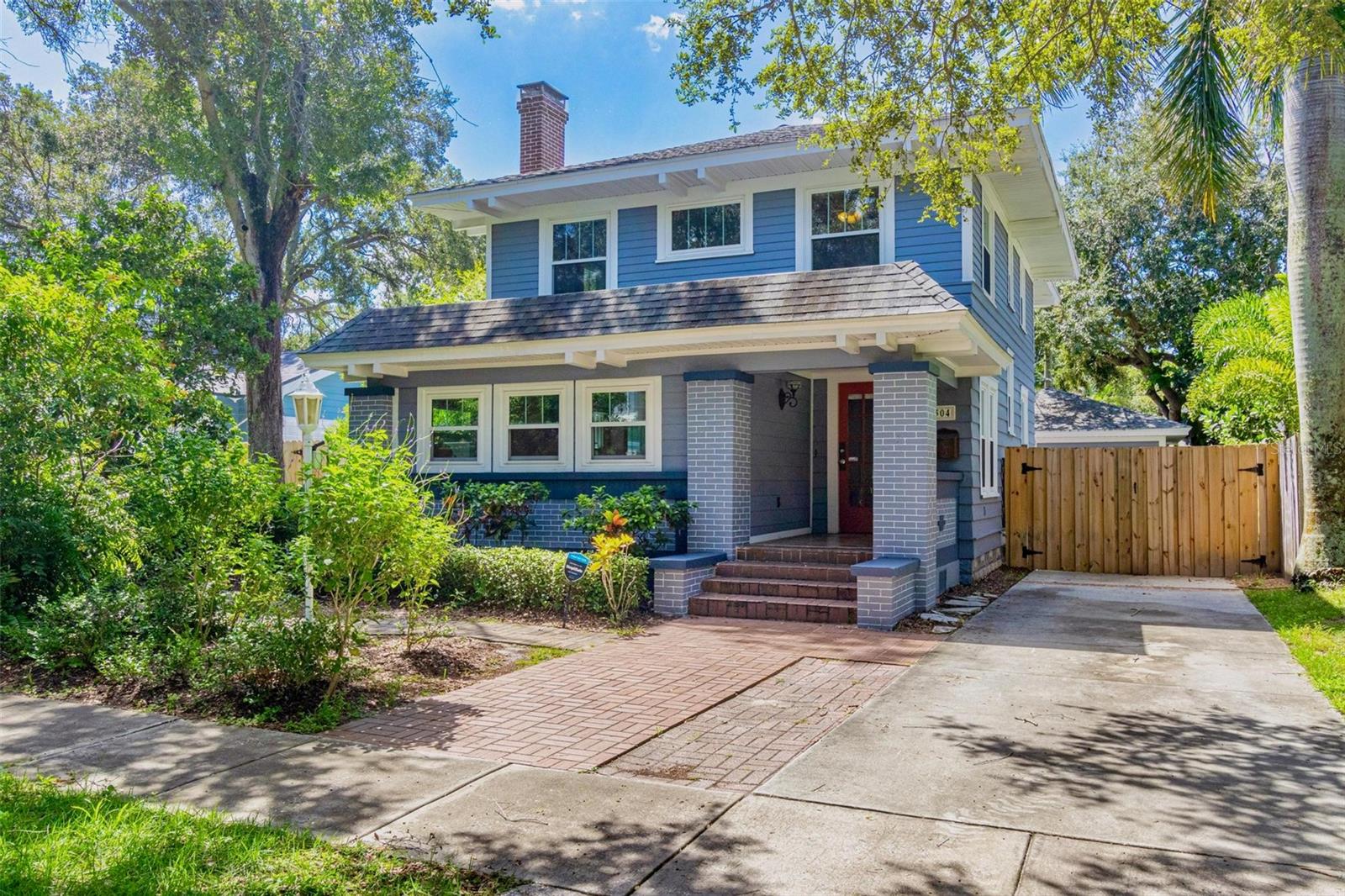 Nestled in the heart of the highly sought-after Historic Old Northeast, this beautifully updated 3-bedroom, 2-bathroom home offers a perfect blend of historic charm and modern convenience. With 1,878 square feet of living space, including a bonus room, this home offers a spacious footprint and is designed for comfortable living and easy entertaining. The kitchen, featuring serene coastal blue cabinets and gleaming white quartz countertops, provides a fresh, inviting space for culinary creativity. Beautiful hardwood floors grace the main living areas, where natural light pours in through abundant windows, highlighting the cozy wood burning fireplace in the living room. Recent updates include a tankless water heater, whole house water filtration system, and hurricane-grade windows. The exterior was freshly painted in 2023, and a new deck was added, creating the perfect spot for outdoor relaxation and entertaining. The home is complete with roomy bedrooms, a stackable washer/dryer closet, and a backyard perfect for hosting gatherings, featuring the aforementioned new deck and a pavered area under a covered pergola. The vinyl fenced-in yard offers privacy, and wooden double gates leads to an elongated parking pad, ideal for additional parking or storing a boat or RV. Stunning curb appeal welcomes you to this charming property, and the location couldn’t be better. Situated on the north end of Historic Old Northeast, you’ll enjoy easy access to a vibrant community with tree-lined streets, historic architecture, local parks, and proximity to the St. Pete Pier, museums, dining, and shopping. This home combines modern updates with timeless charm, offering the best of both worlds in a prime St. Petersburg location.