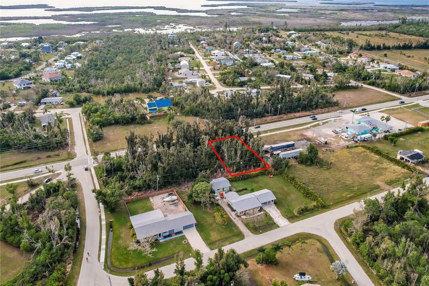In the bustling part of Bokeelia, Florida, lies an exceptional opportunity for those with DREAMS OF BUILDING! This COMMERCIALLY ZONED LOT is an untouched canvas waiting for you to build! With the empty lots behind and next to this one, your building will be the main attraction of this busy street! Whether you envision building an OFFICE SPACE, STOREFRONT, or any number of BUSINESS VENTURES - this is the location for you! Send in your offer for this bustling property today!